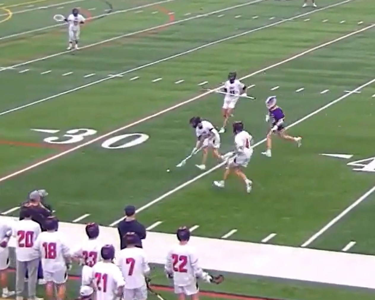 (PHOTO: Three Rye Boys Lacrosse players go for a gorund ball in their 12-1 victory over JJCR on Tuesday, May 6.)