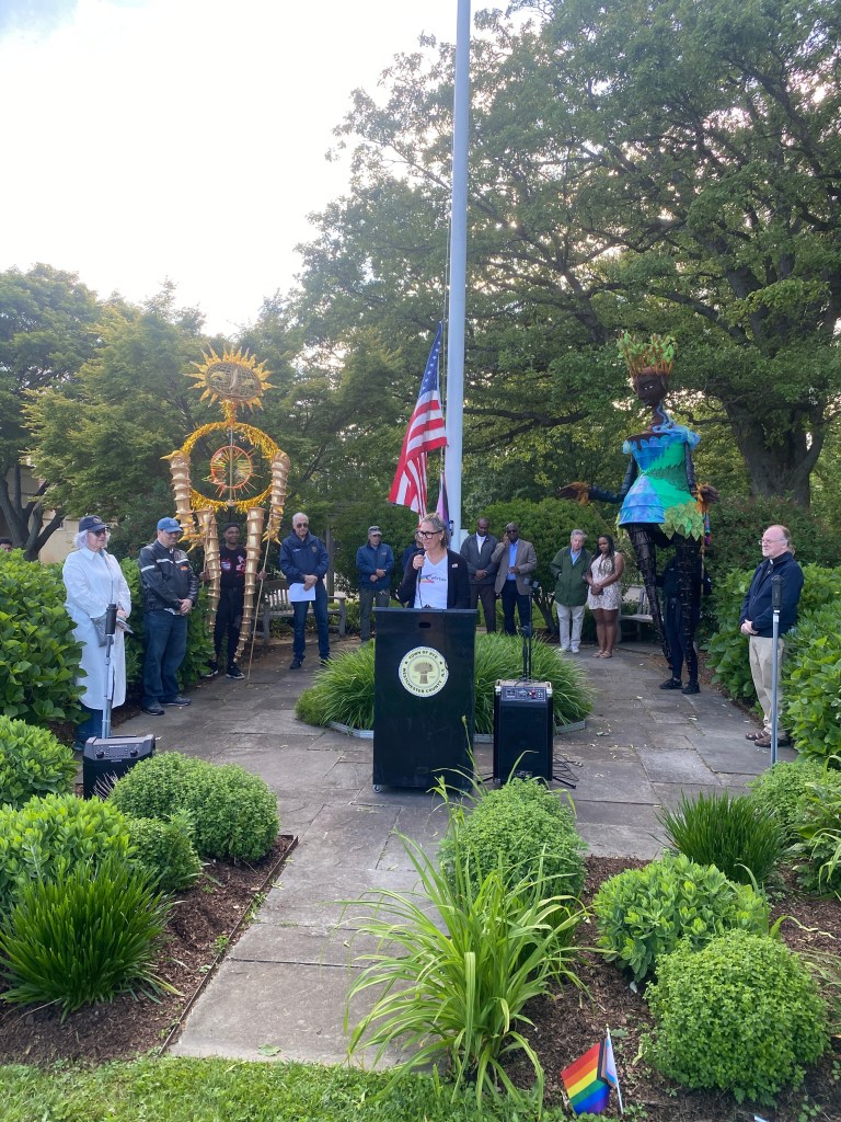 (PHOTO: The Fifth Annual Pride Month Celebration was held in Rye Town Park on May 31, 2025, organized by the Town of Rye, Rye Town Park, and pRYEde. pRYEde 's Amanda Timchak making remarks.)