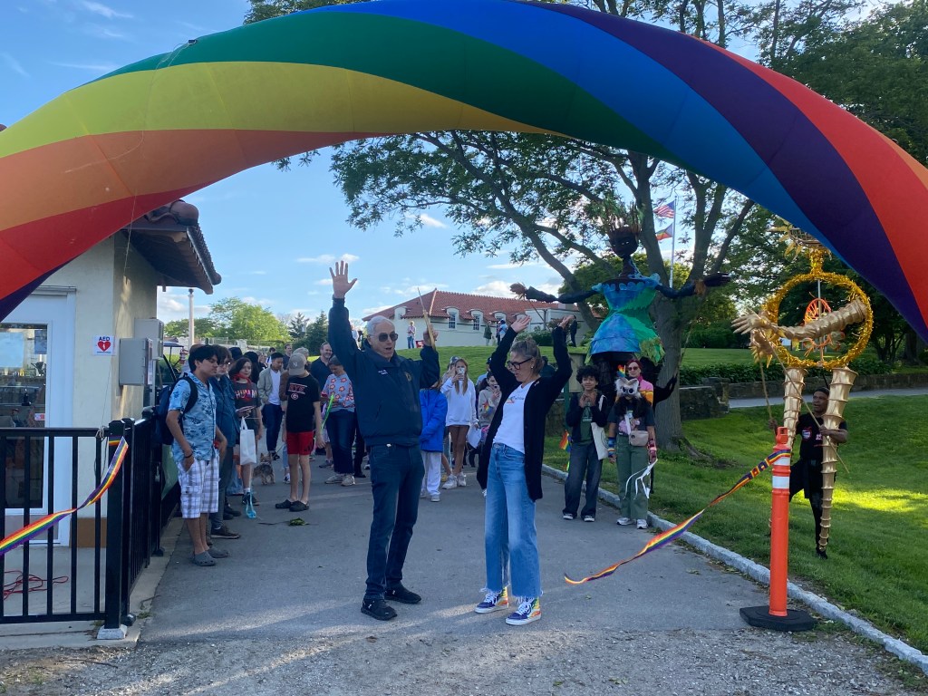 (PHOTO: The Fifth Annual Pride Month Celebration was held in Rye Town Park on May 31, 2025, organized by the Town of Rye, Rye Town Park, and pRYEde. pRYEde 's Amanda Timchak and Rye Town Supervisor Gary Zuckerman cut the parade ribbon.)