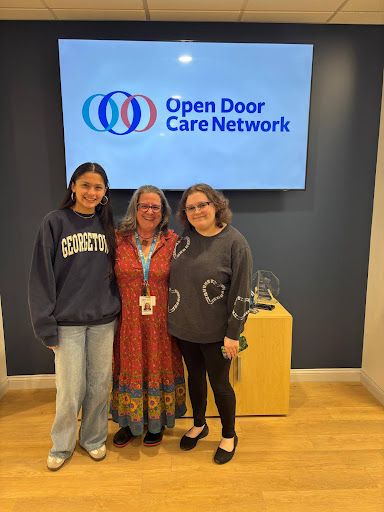 (PHOTO: Ashley Hernandez (left) with Open Door coordinator Wendy Armstrong and Open Door employee.)