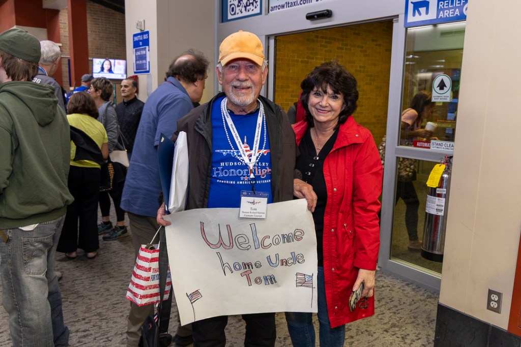 (PHOTO: Seven Rye veterans participated in an honor flight to Washington, D. C. on Saturday, May 31, 2025. Tom Battista greeted by Faith Battista at welcome back reception. Contributed.)