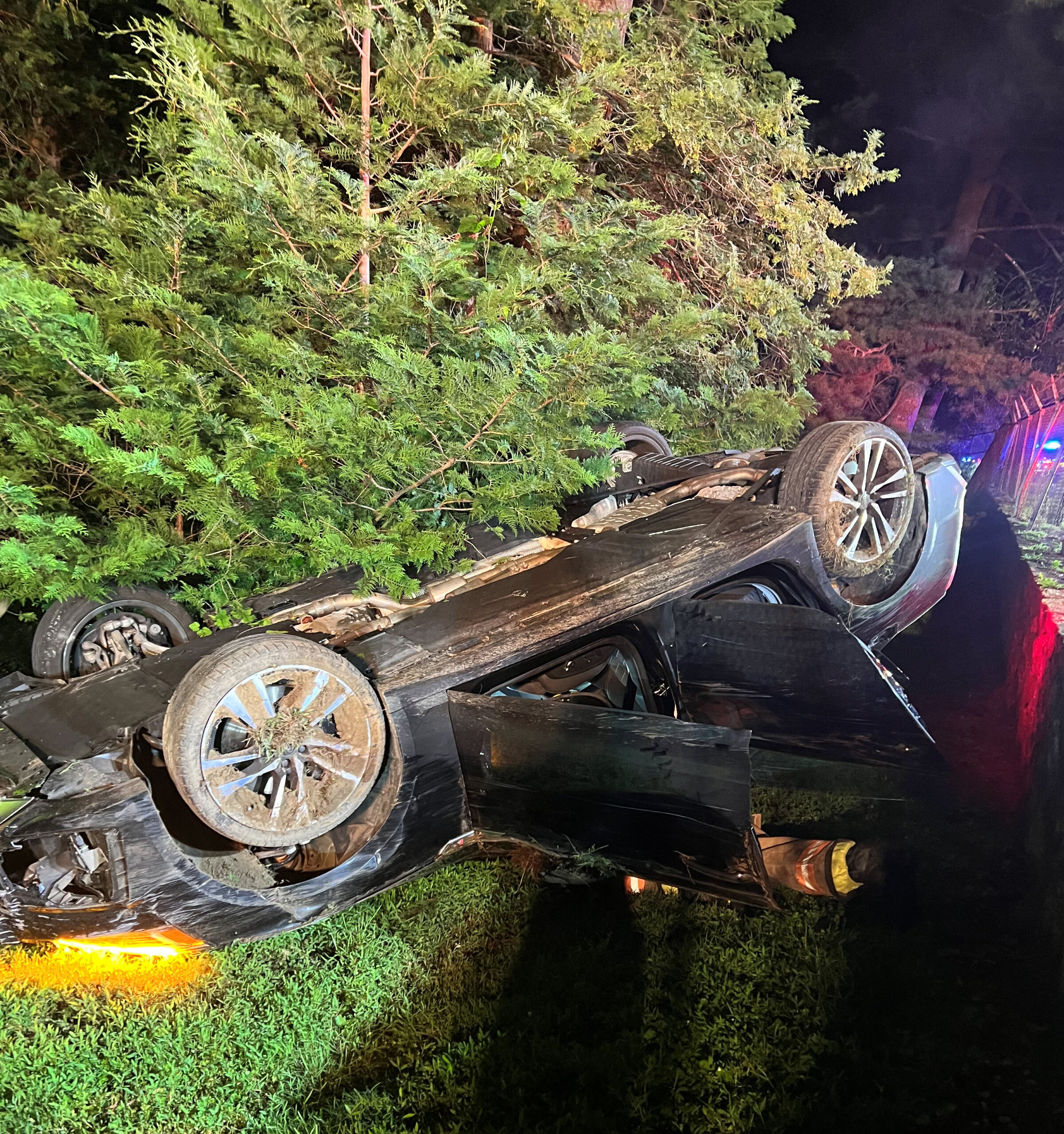 (PHOTO: An 18 year old was driving this Audi sedan when the car flipped off the Boston Post Road on Friday night, July 25, 2025. Source: Rye PD.)