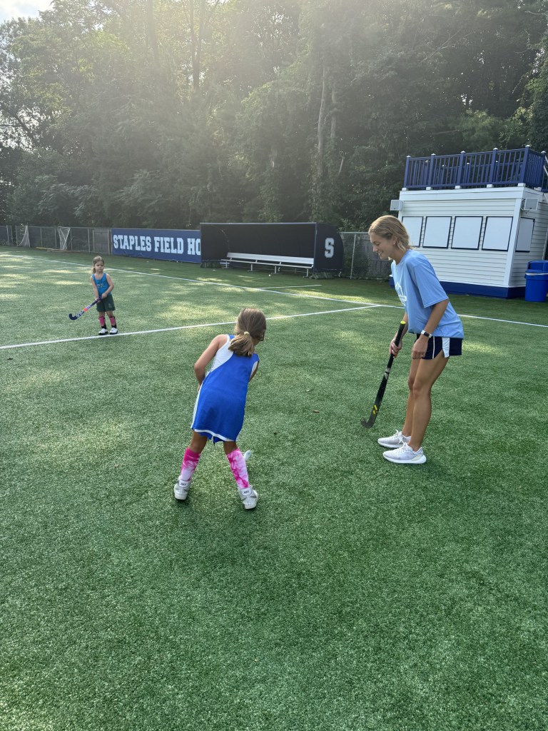 (PHOTO: Valerie Perkins coaching youth players at Westport Area Summer Field Hockey Camp. Contributed.)