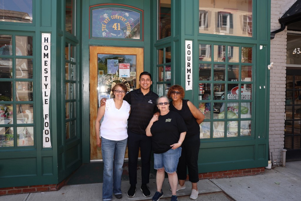 (PHOTO: Marion Anderson meeting and greeting the community at Rye Country Store. Left to right: Anderson, (unidentified), Mary Kay Fox, Ingraham Taylor. Contributed.)