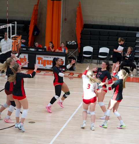(PHOTO: The Rye Volleyball team celebrates a point against the Mamaroneck Tigers on September 11, 2025. Credit: Tatia Chkheidze.)