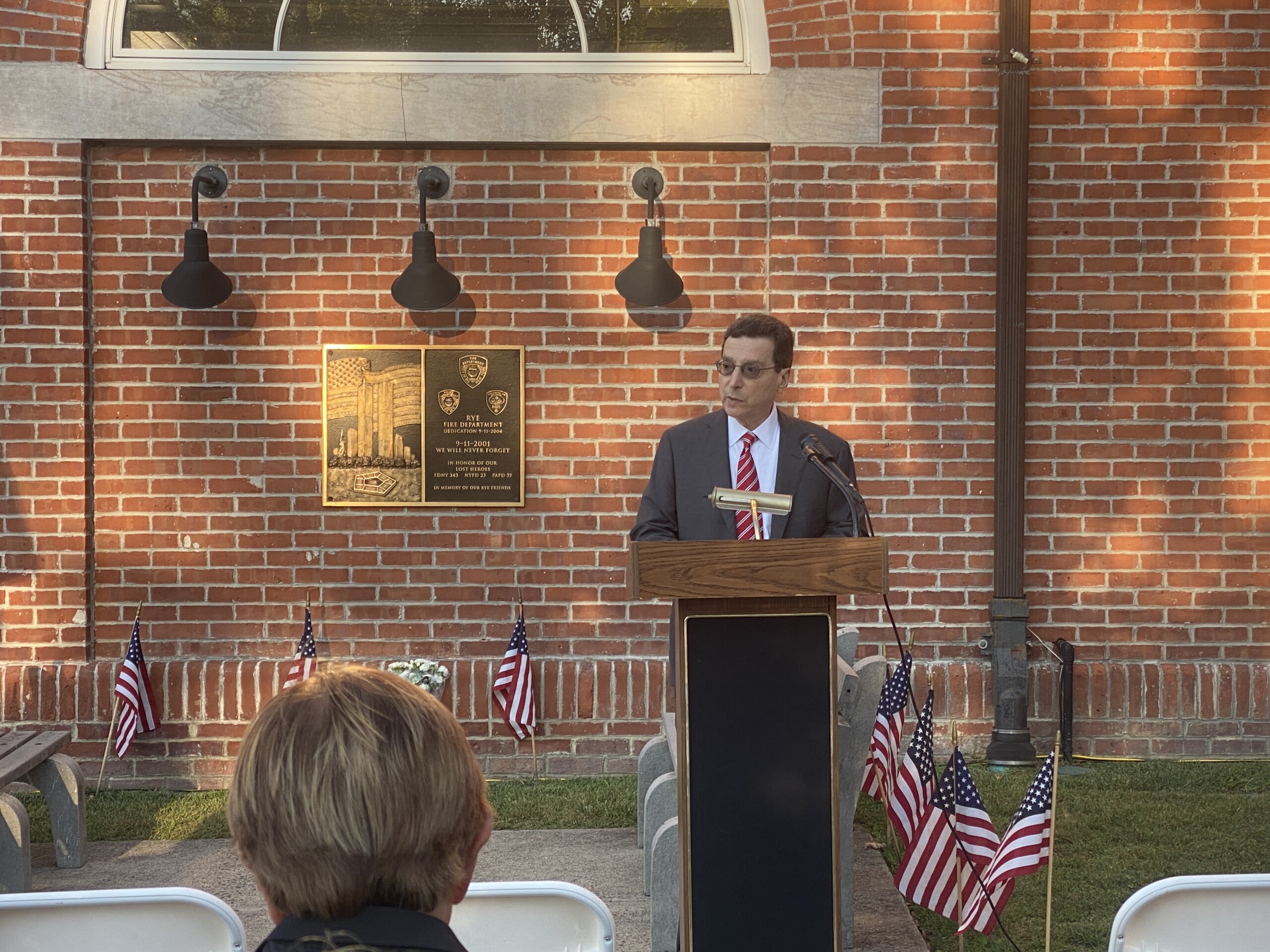 (PHOTO: Rye Mayor Josh Cohn addressing the crowd at the City of Rye's annual September 11th Commemoration Ceremony on Thursday, September 11, 2025.)