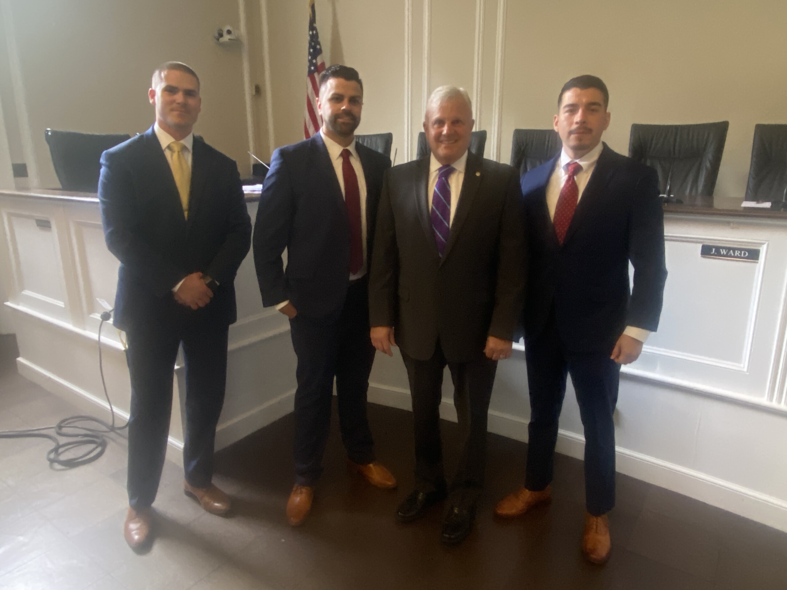 (PHOTO: Detective Alex Whalen, Detective Robert Jones, Public Safety Commissioner Mike Kopy and Sergeant Christopher Salguero at the Rye PD promotion ceremony at Rye City Hall on September 17, 2025.)