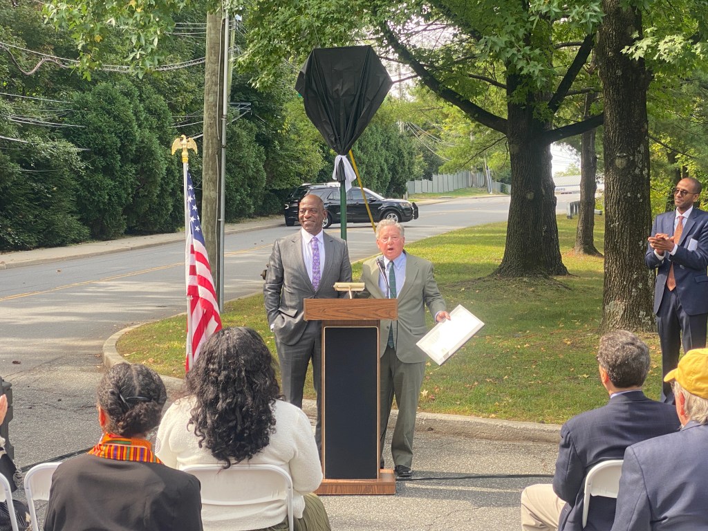 (PHOTO: The Paul & Orial Redd Way street naming at the Rye train station on September 27, 2025. State Assemblyman Steve Otis.)