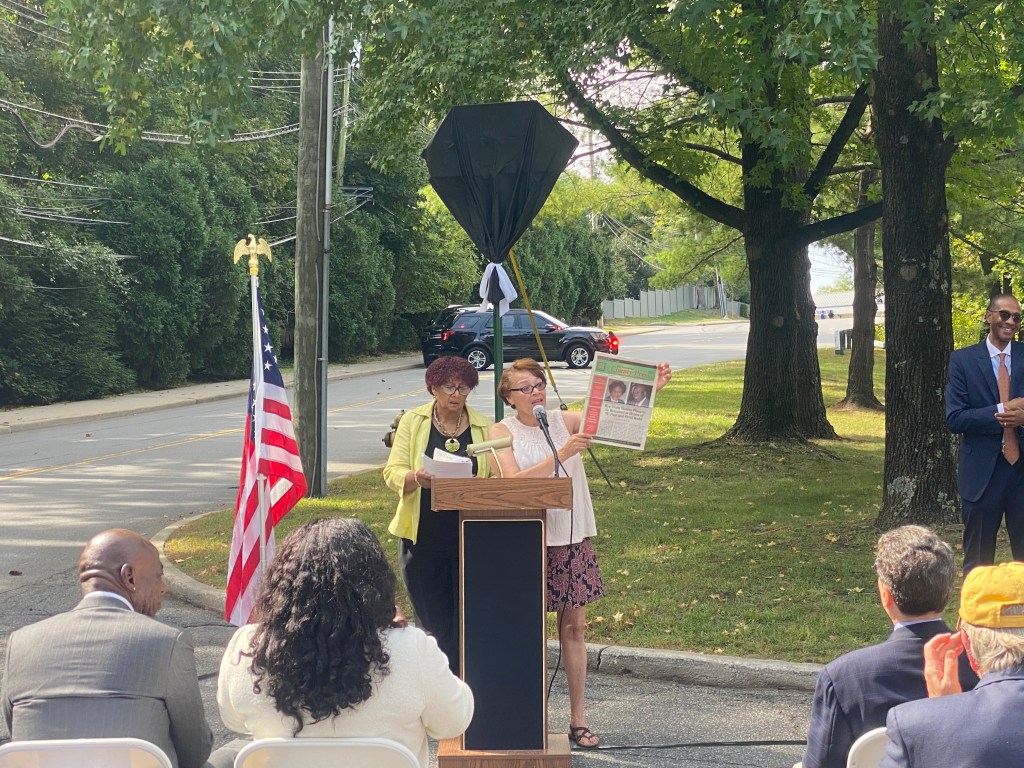 (PHOTO: The Paul & Orial Redd Way street naming at the Rye train station on September 27, 2025. Organizers Ingraham Taylor and Marion Anderson celebrate The Westchester County Press and its service to the African American community.)