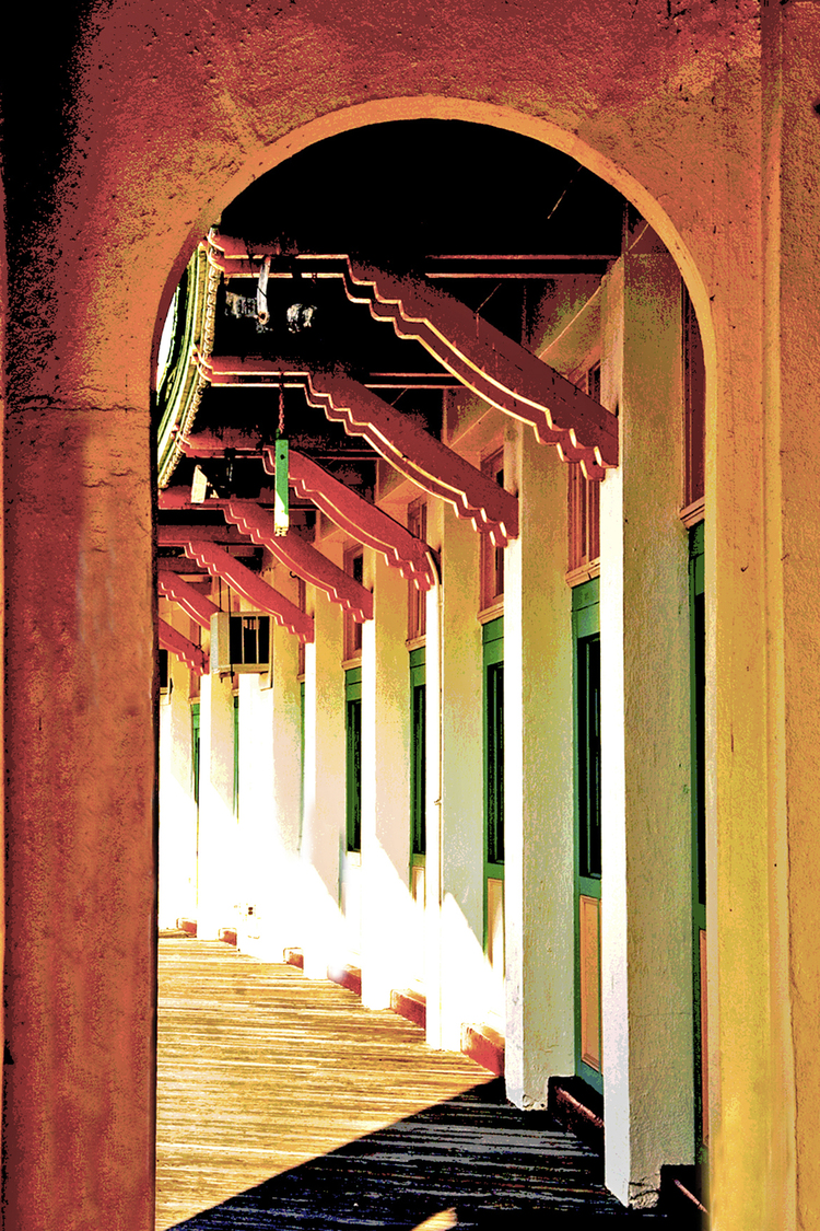 [PHOTO: Playland Boardwalk. Under the awning that stretches the length of the shore. By JoAnn Cancro.]