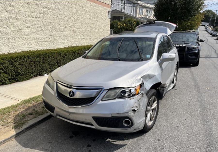 (PHOTO: The stolen Acura RDX that passed a Rye Police Department patrol car on Saturday, September 13, 2025 was recovered next to the Dunkin Donuts on Leonard Street in Port Chester. Source: Rye PD.)