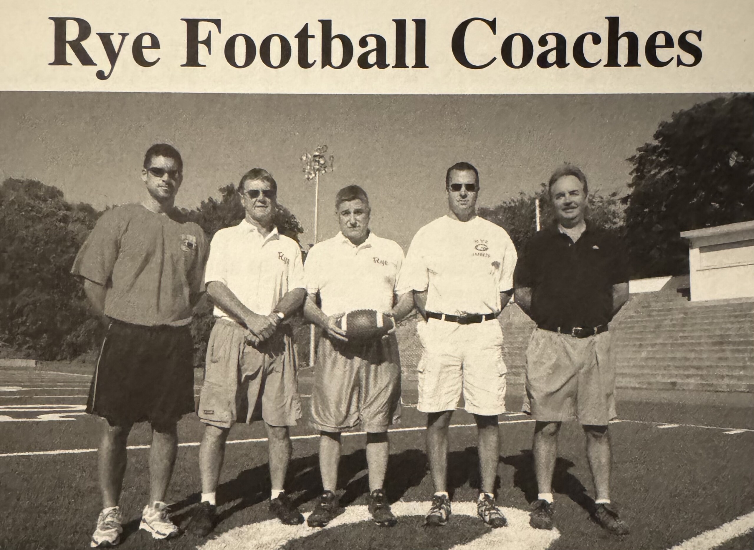 (PHOTO: The 2005 State-champion Rye Football coaching staff. L to R: Coach Bruno, Coach Maloney, Coach Garr, Coach Massett, and Coach Charney. Contributed.)