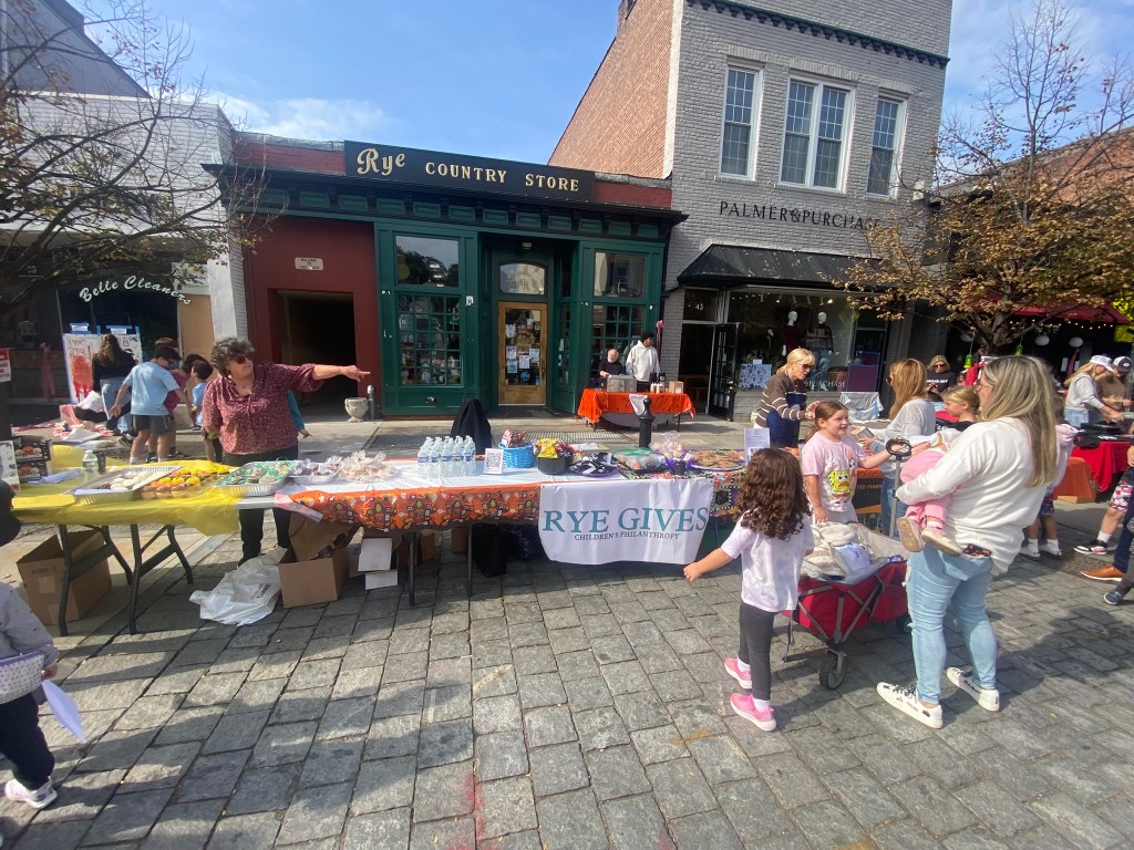 (PHOTO: The 72nd Annual Halloween Window Painting (and second annual parade) on Purchase Street in Downtown Rye, NY on October 19, 2025.)