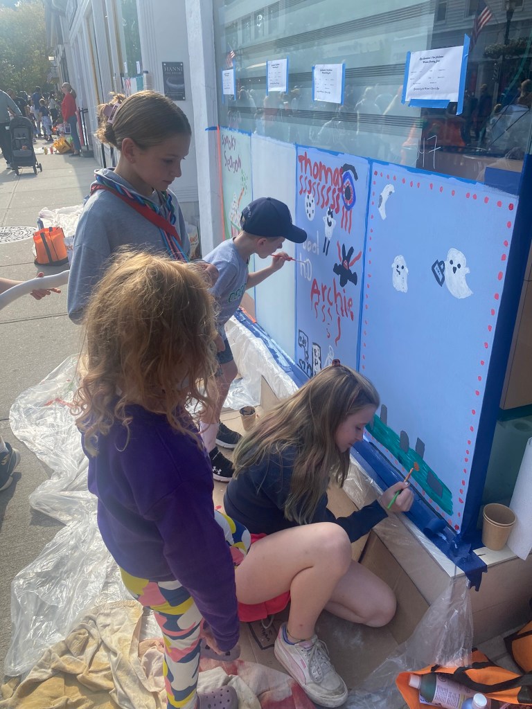 (PHOTO: The 72nd Annual Halloween Window Painting (and second annual parade) on Purchase Street in Downtown Rye, NY on October 19, 2025.)