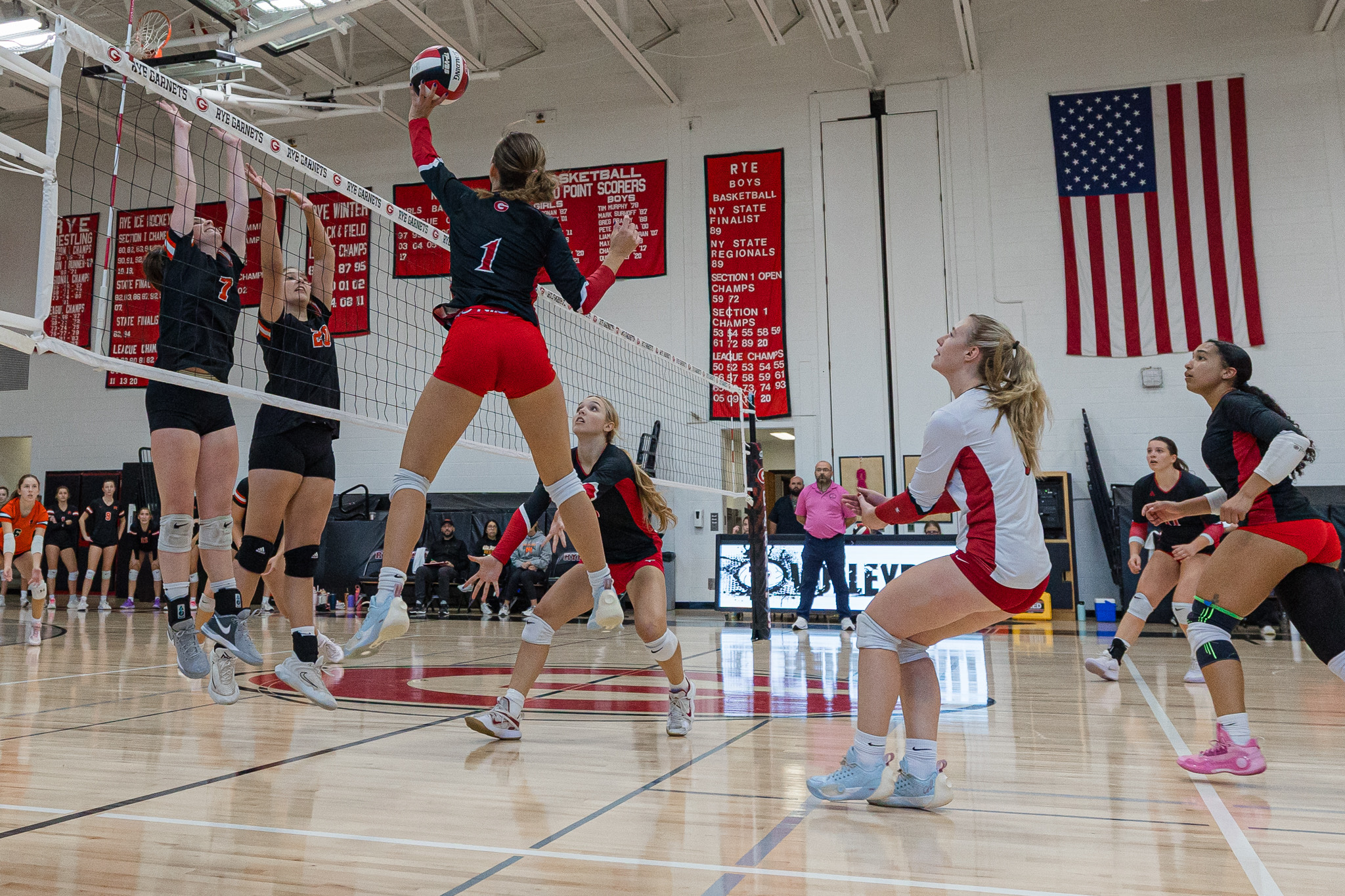 (PHOTO: The Rye Volleyball team playing a point against Mamaroneck on October 21, 2025. Credit: Maureen Tsuchida.)