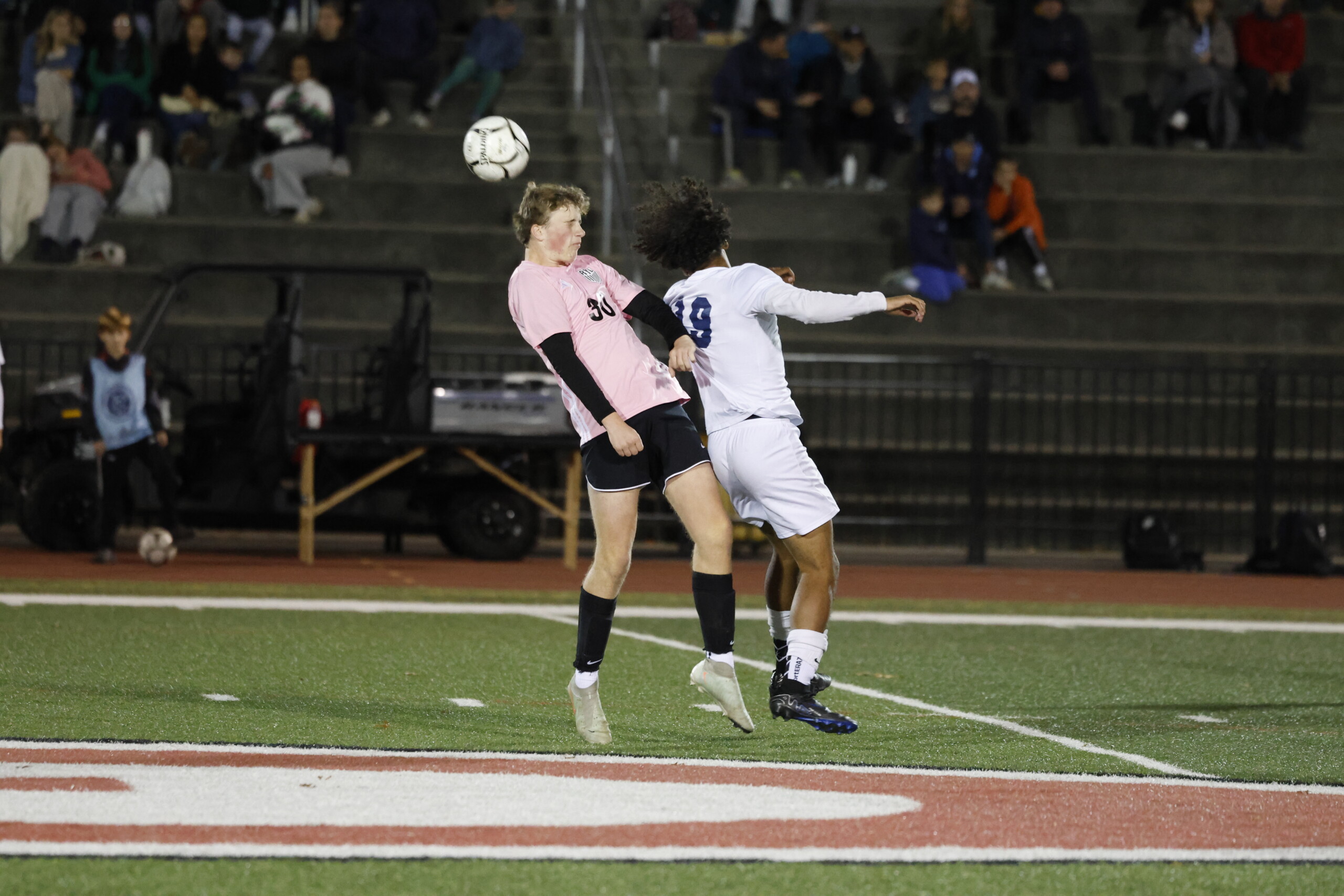 (PHOTO: Rye Boys Soccer's Christian Hofmann (#3) going for a header against Walter Panas in a 3-1 win on October 29, 2025. Credit: Alvar Lee.)