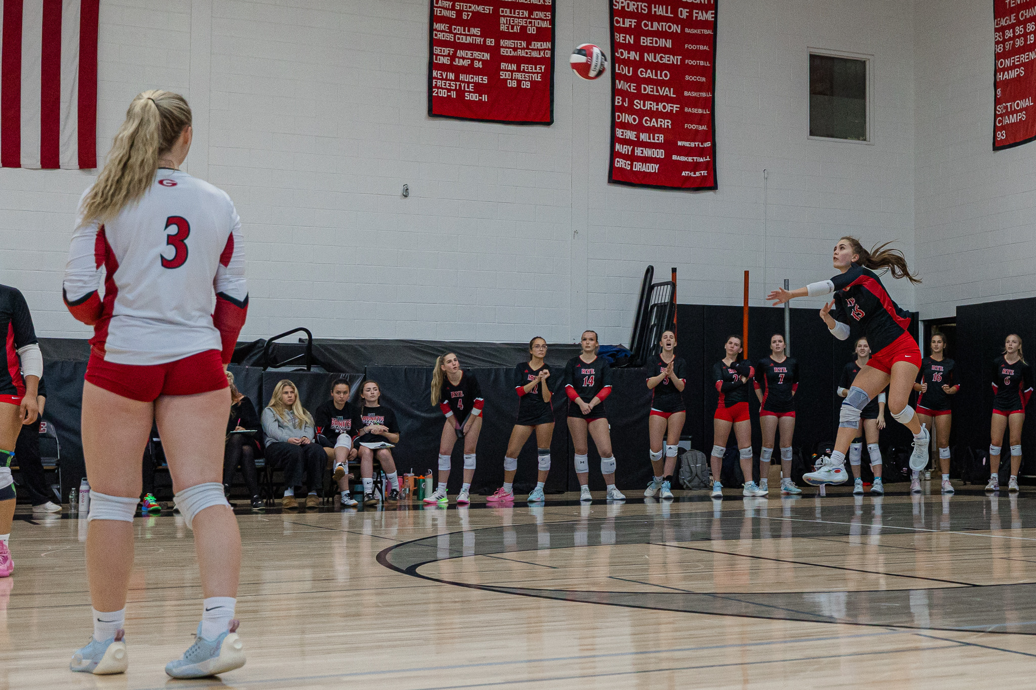 (PHOTO: The Rye Volleyball team serving from a game on October 21, 2025. Credit: Maureen Tsuchida.)