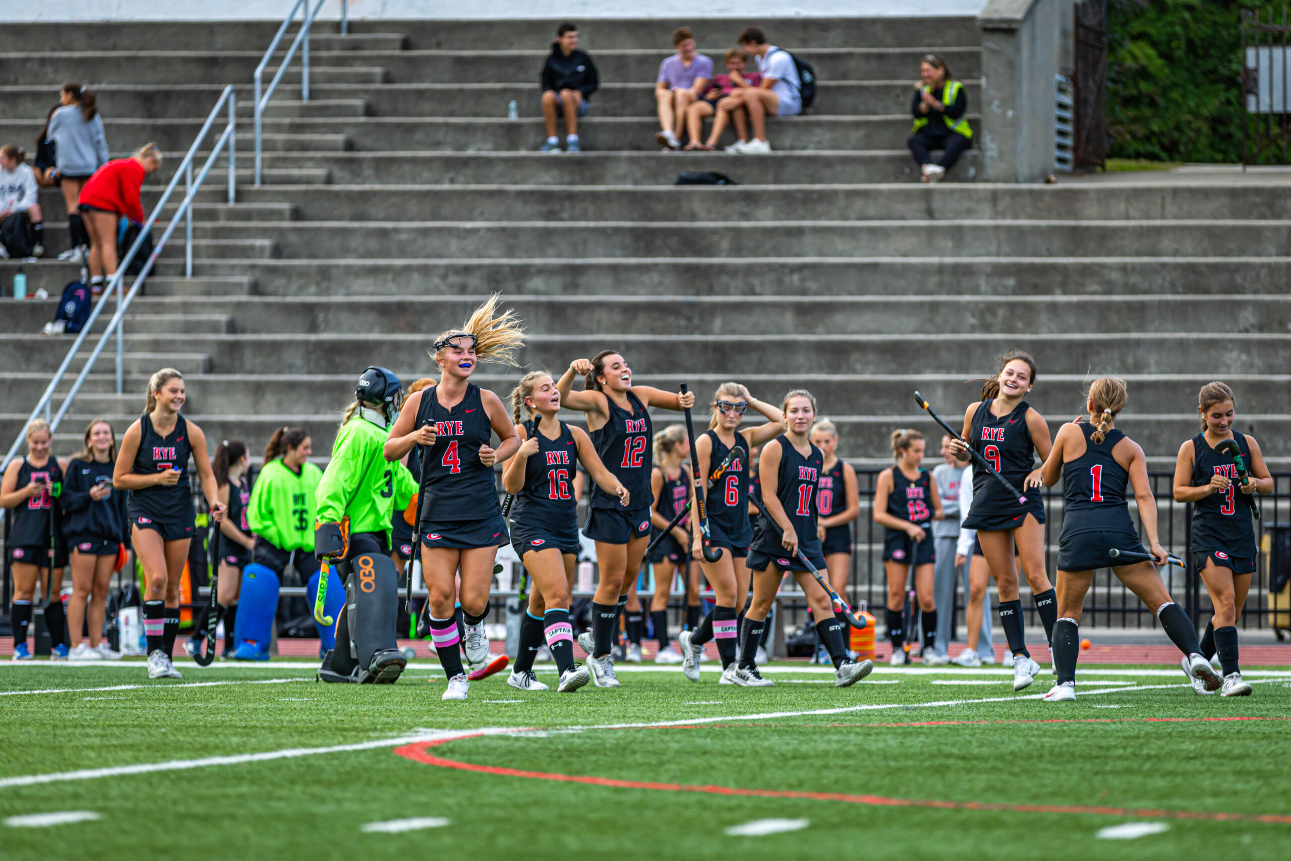 (PHOTO: The Rye Field Hockey team celebrating on September 16, 2025. Credit: Maureen Tsuchida.)