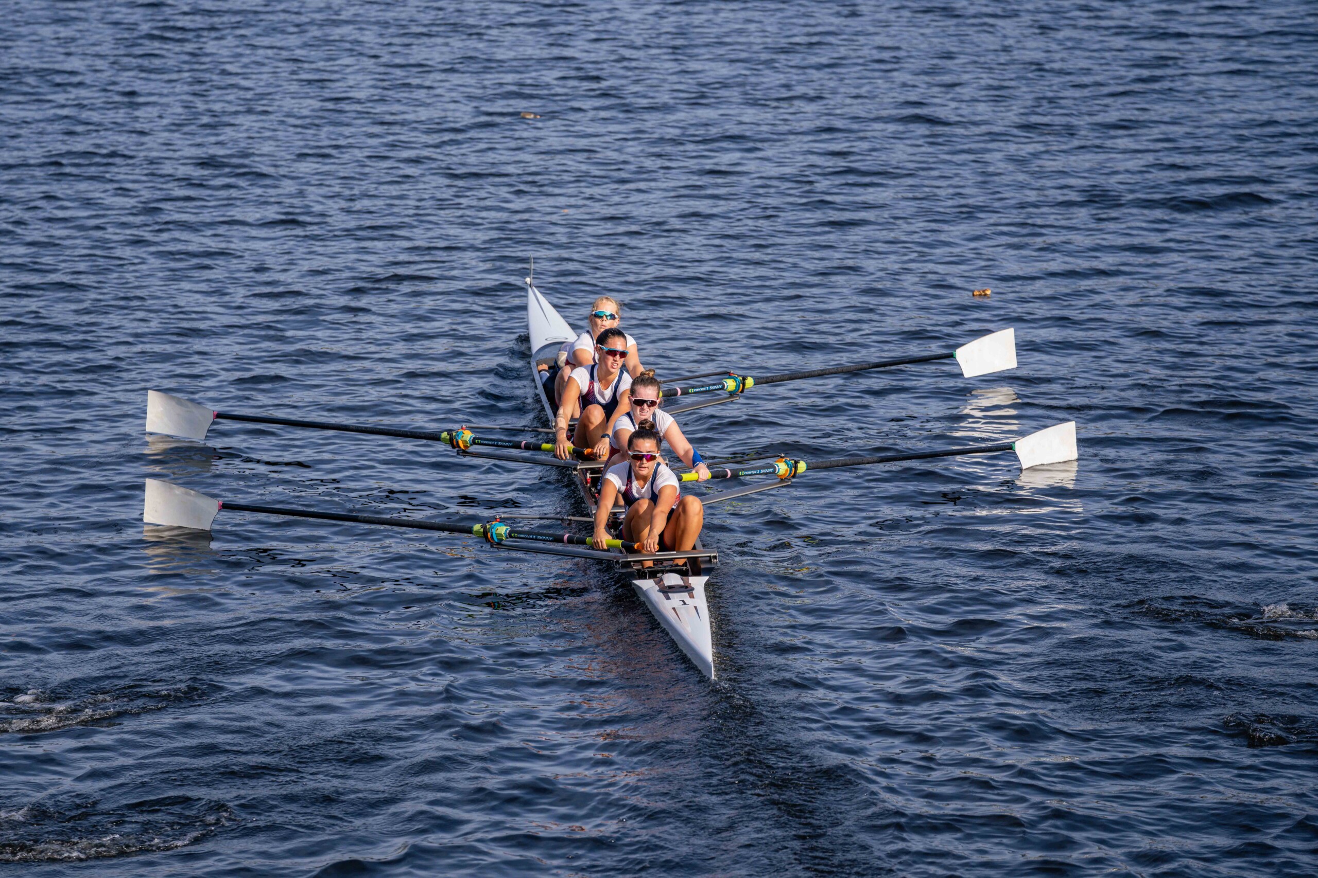 (PHOTO: The RowAmerica Rye Women's Youth 4+ boat at the 2025 Head of the Charles Regatta. The boat is comprised of Kiran Joshi, Kathryn Maclean, Bari Mounty, Maddie Ford, and Sophia Granitto. Contributed.)