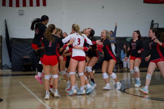 (PHOTO: The Rye Volleyball team celebrates their match-winning point against Walter Panas on November 1, 2025. Credit: Tatia Chkheidze.)