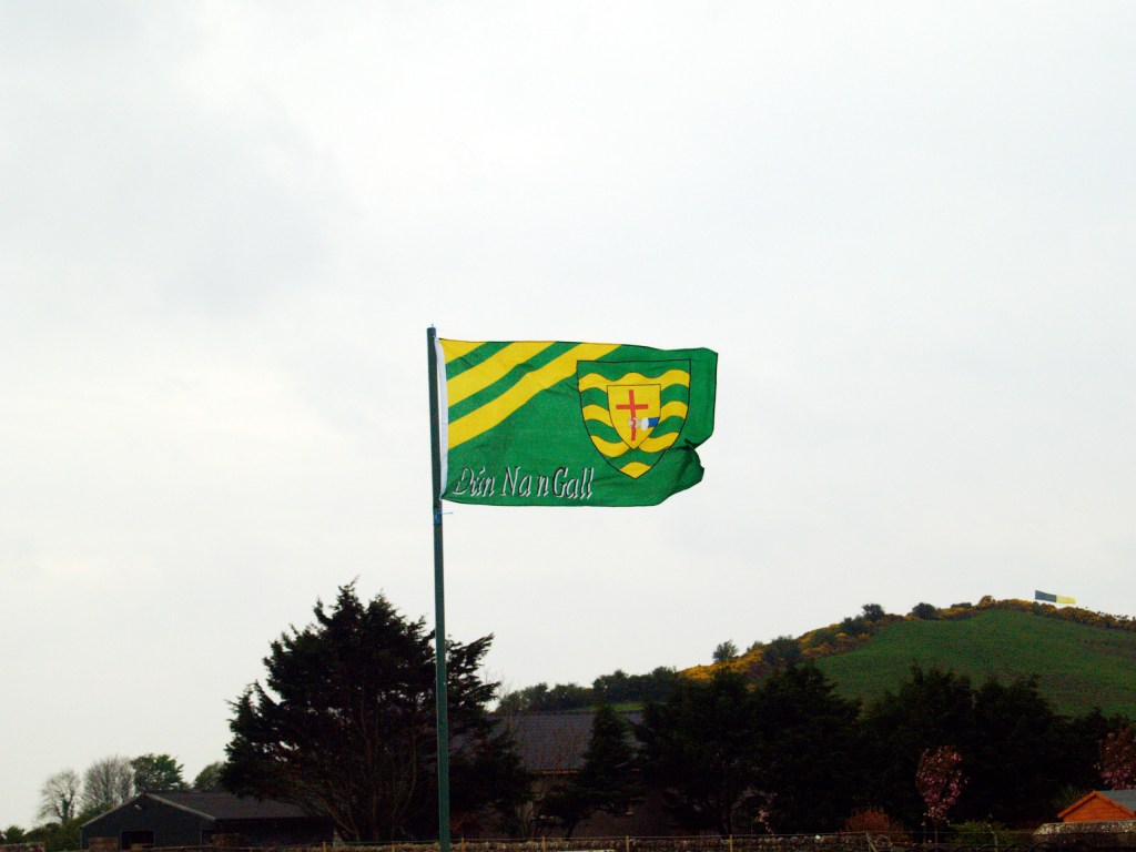 (PHOTO: Donegal County Flag. Sunday 22/4/07. The Gaelic football team played in the final of the 2007 National Football League. Public Domain.)