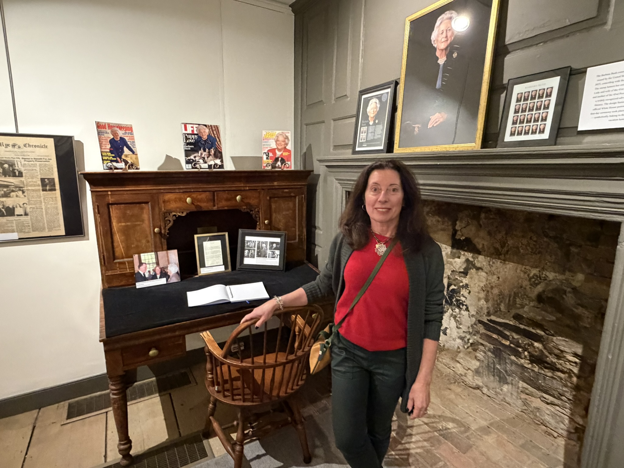 (PHOTO: The Season of Giving celebration at the Square House on November 30, 2025, organized by the Rye Historical Society (RHS). RHS Board President Jackie Jenkins at the new exhibit celebrating former First Lady Barbara Bush. Bush grew up in Rye's Indian Village neighborhood.)
