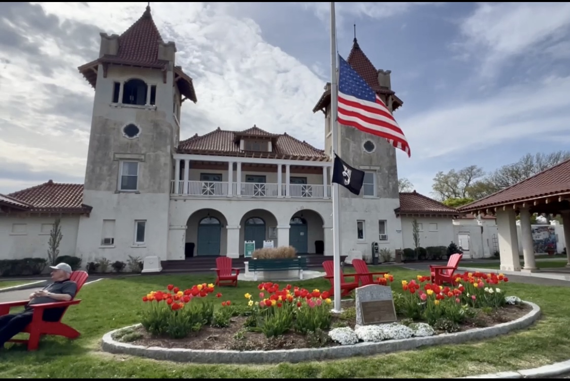 (The newly landscaped garden area in front of the Tower Building, complete with new red Adirondack chairs. Contributed.)