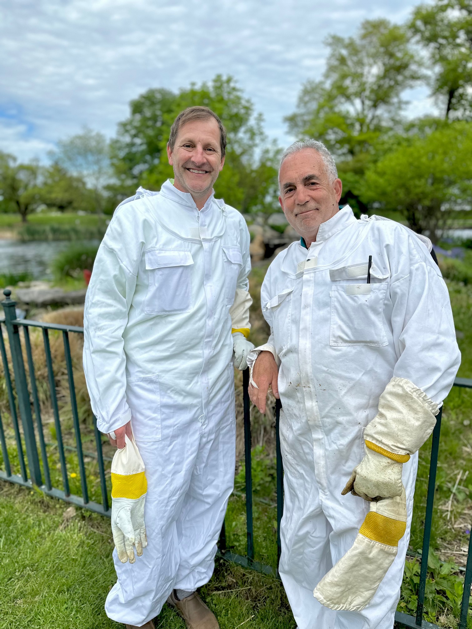 (PHOTO: Friends of Rye Town Park Treasurer and Beekeeper Chris Meier and Park Director Russ Gold take a break from their beekeeping duties. Contributed.)
