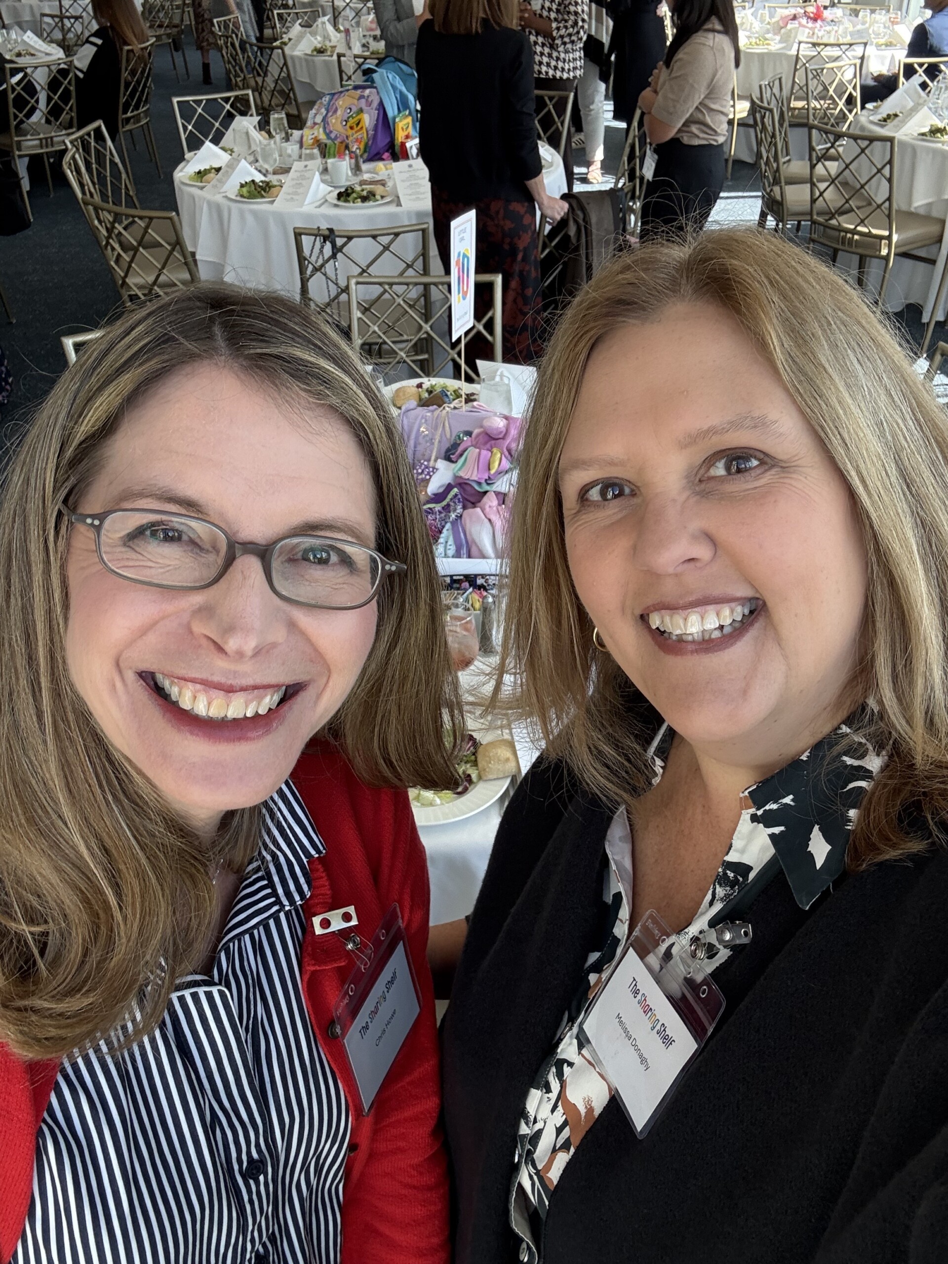 (PHOTO: Junior League of Westchester on the Sound President Chris Howe with Melissa Keras-Donaghy, VP of membership for the Sharing Shelf, one of JLWOS's community partners. Contributed.)