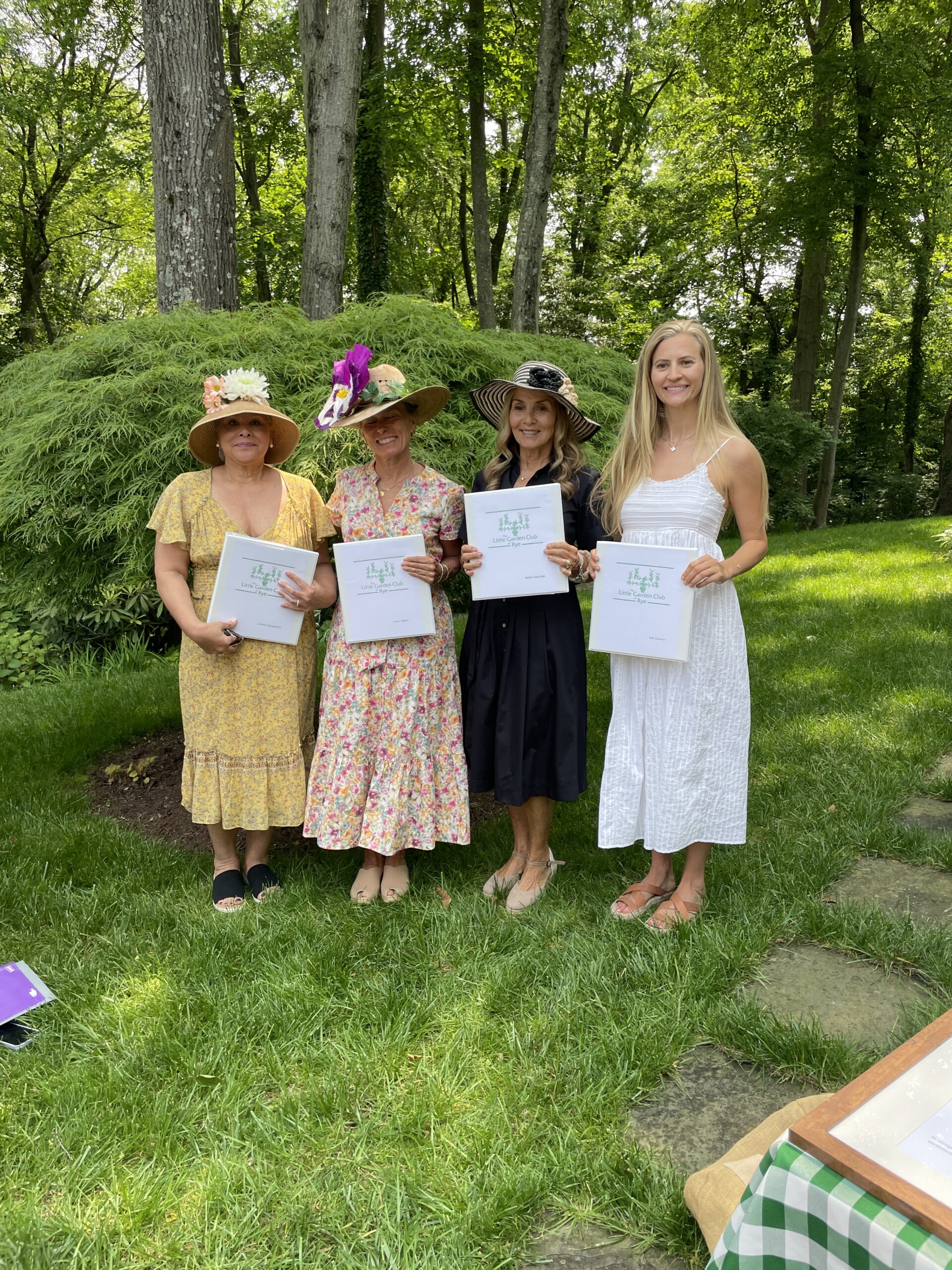 (PHOTO: Carmen Konigsbach, Gwen Millard, Bobbi Cavicchio and Ella Cannon - all incoming provisional members of the Little Garden Club of Rye. They are holding their new member binders. Contributed.)