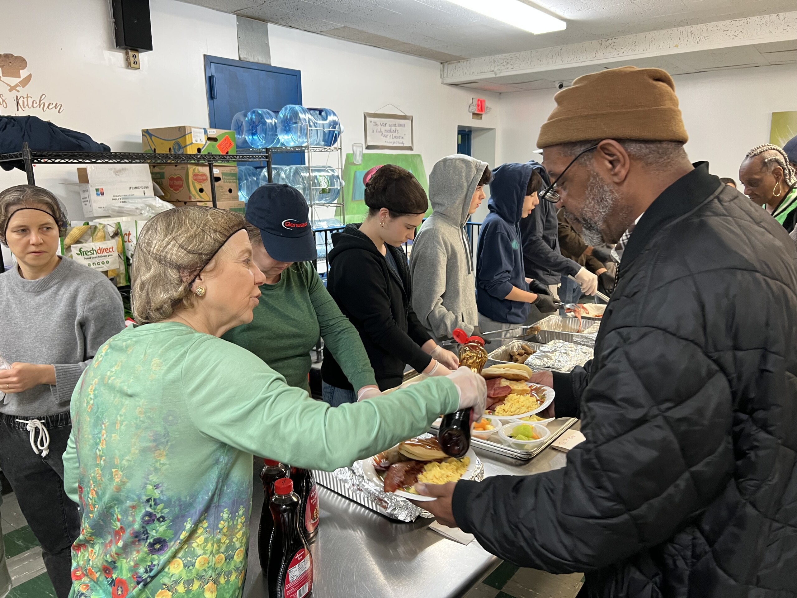 (PHOTO: New York State Senator Shelley Mayor at HOPE serving clients Thanksgiving breakfast. Contributed.)