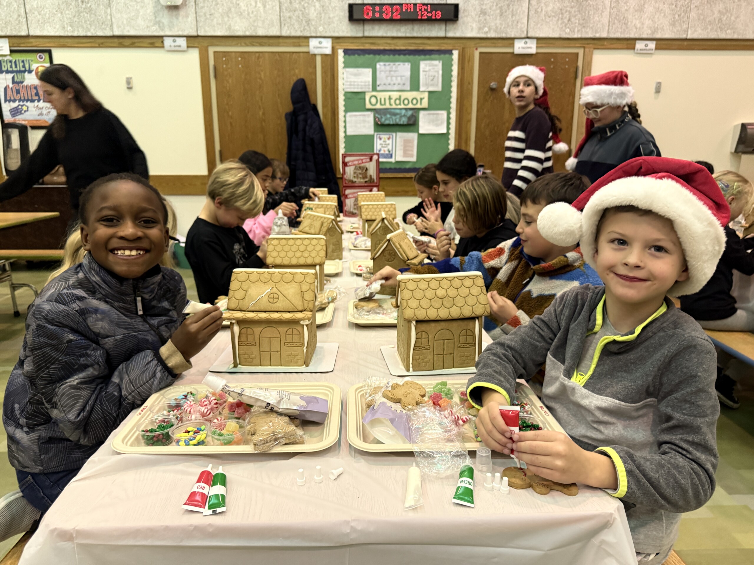 (PHOTO: Kid’s S.P.A.C.E. children decorating gingerbread houses at the Gingerbread Night fundraiser. Contributed.)