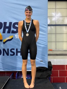 (PHOTO: Rye - Rye Neck - Blind Brook Swim and Dive's Kate Chesley after earning 2025 All-American Consideration for her time in the 100M backstroke at the Sectional tournament. Contributed.)