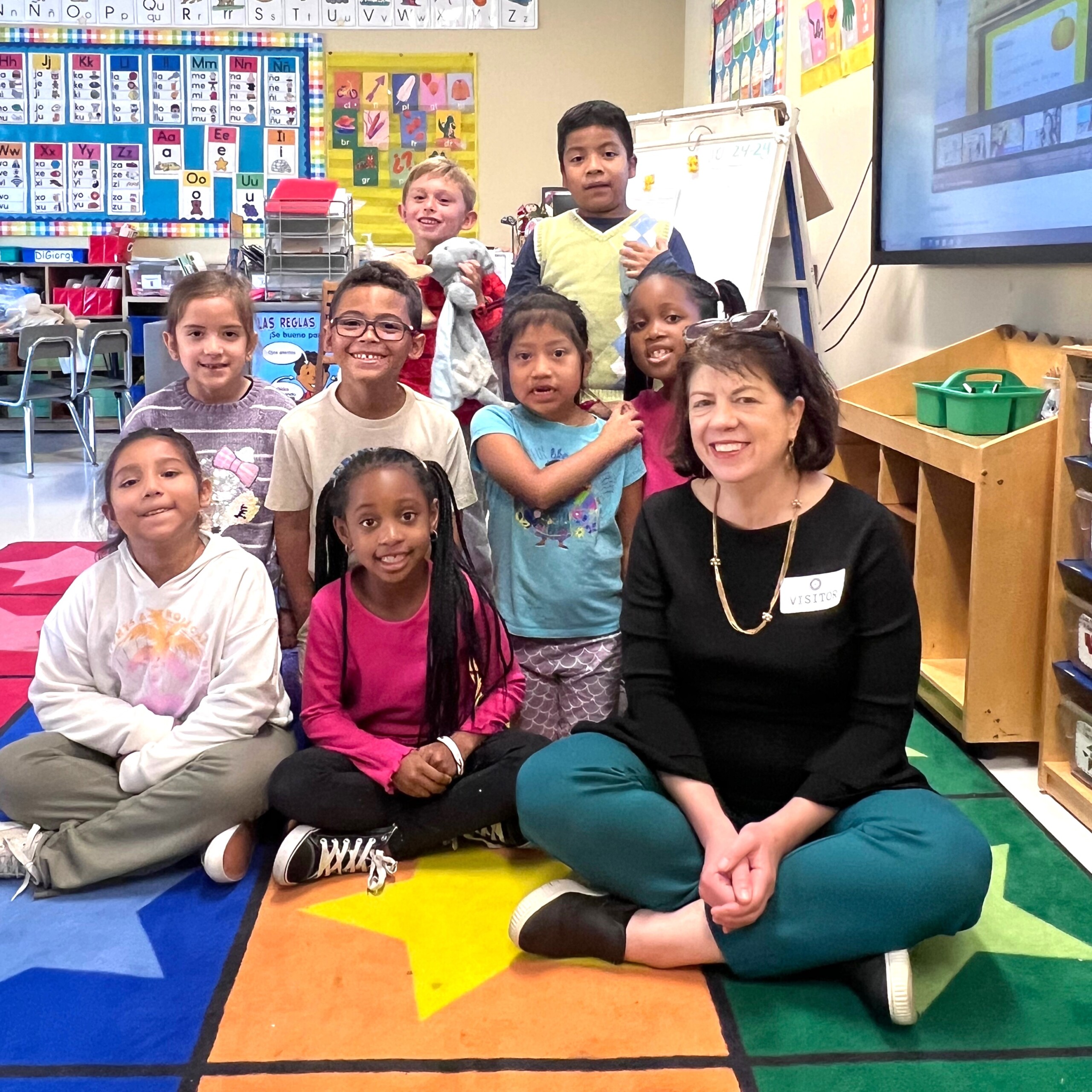 (PHOTO: Anne Bradner, CEO of the Carver Center with children in the afterschool program. Contributed.)