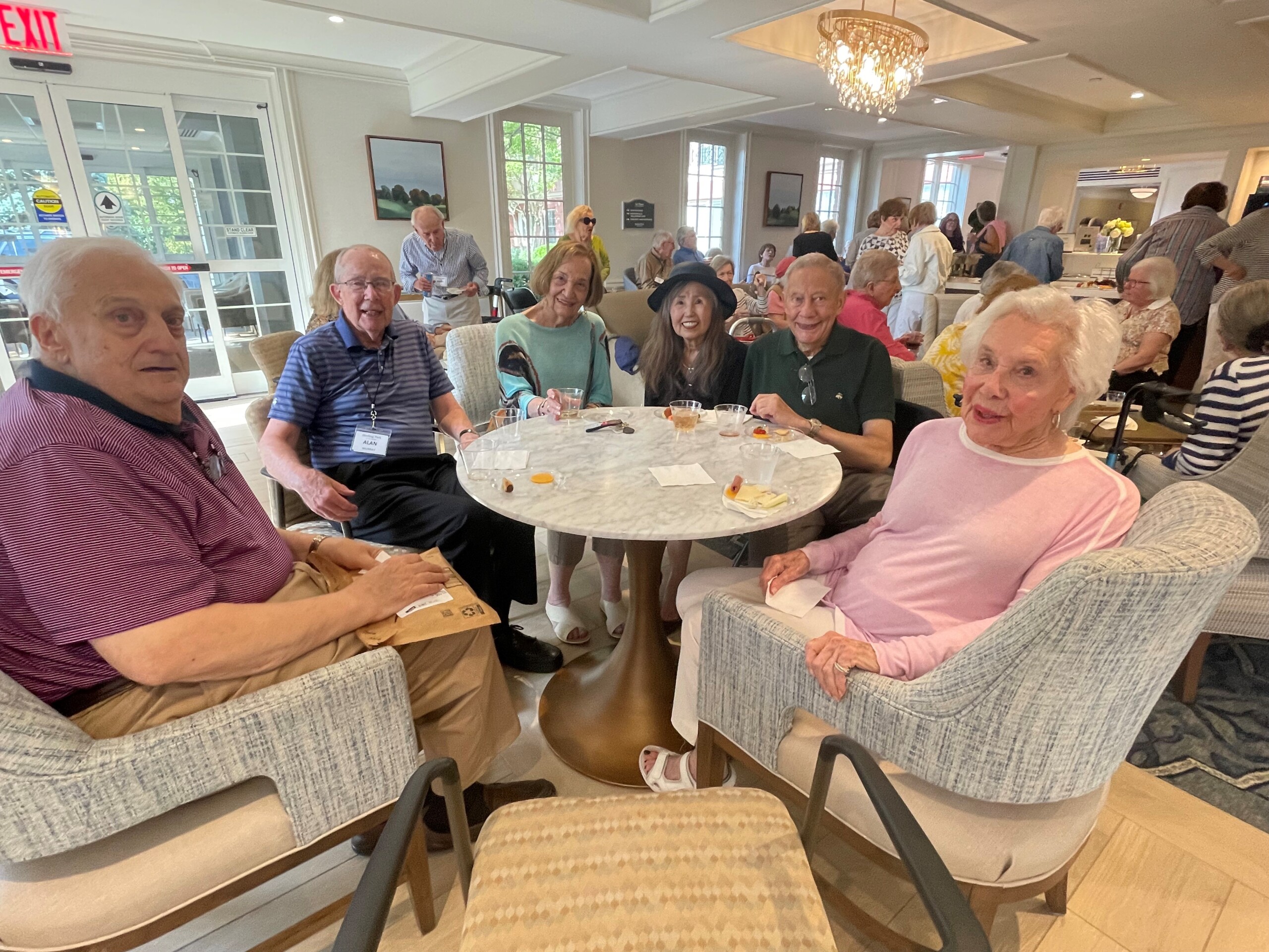 (PHOTO: Osborn Sterling Park residents enjoying the end of summer happy hour in the new resident social lounge. Contributed.)