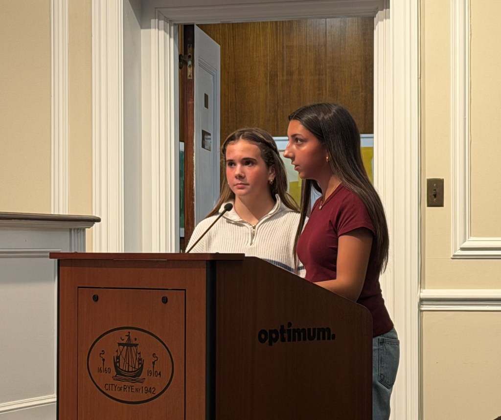(PHOTO: Rye Neck students Victoria Carter and Mariam Asghar expressing safety concerns to Rye City Council members on Wednesday, December 3, 2025.)