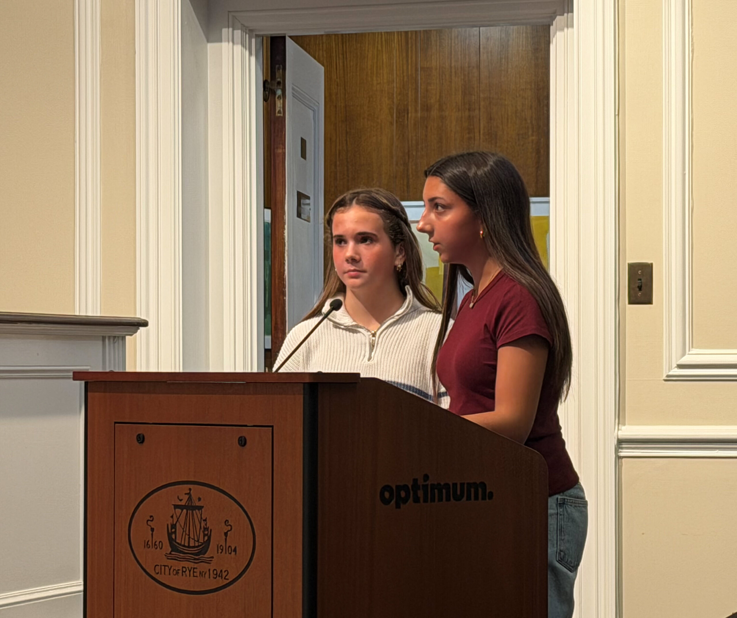 (PHOTO: Rye Neck students Victoria Carter and Mariam Asghar expressing safety concerns to Rye City Council members on Wednesday, December 3, 2025.)