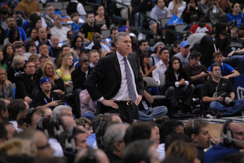 (PHOTO: Mike D'Antoni watching Lakers vs Mavs, February 2013. Public Domain via Wikimedia Commons.)