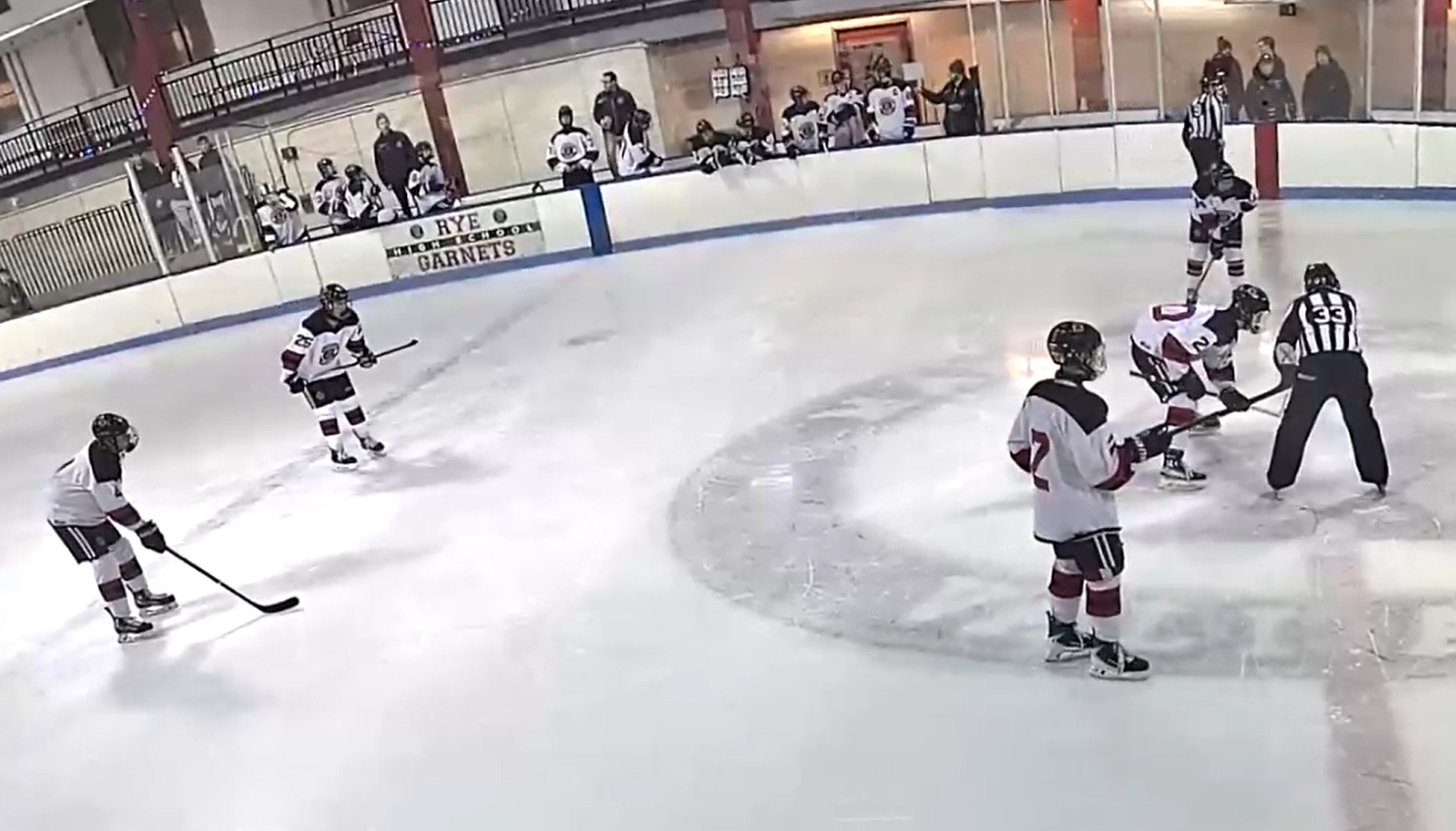 (PHOTO: The Rye Hockey team lined up for the opening face off on December 17, 2025.)