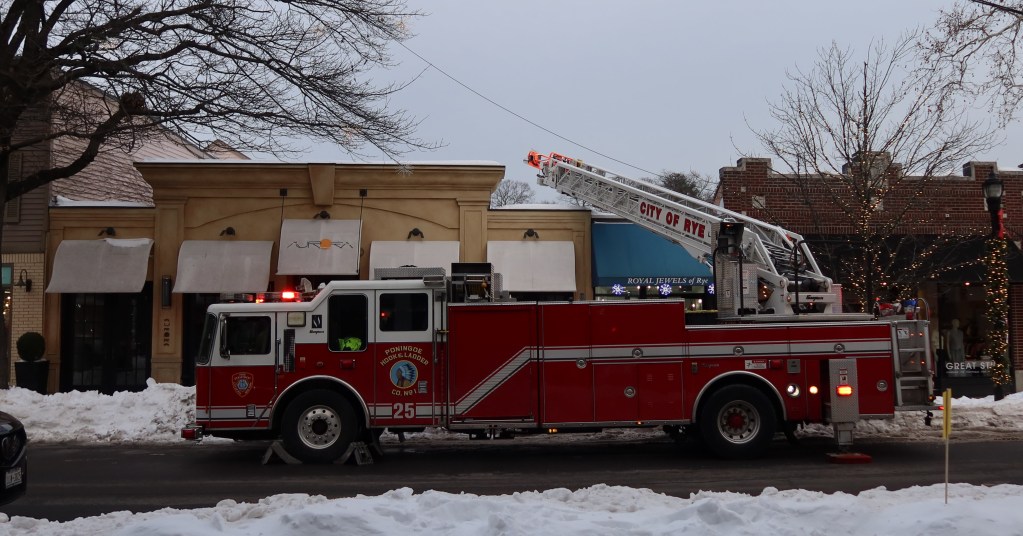 (PHOTO: Rye FD extinguished a fire on the roof of Aurora Restaurant in downtown Rye at 60 Purchase Street on Wednesday afternoon, January 28, 2026. The fire was determined to be accidental in nature, originating from an attempt to remove ice from the roof and gutter area. Source: Rye FD.)