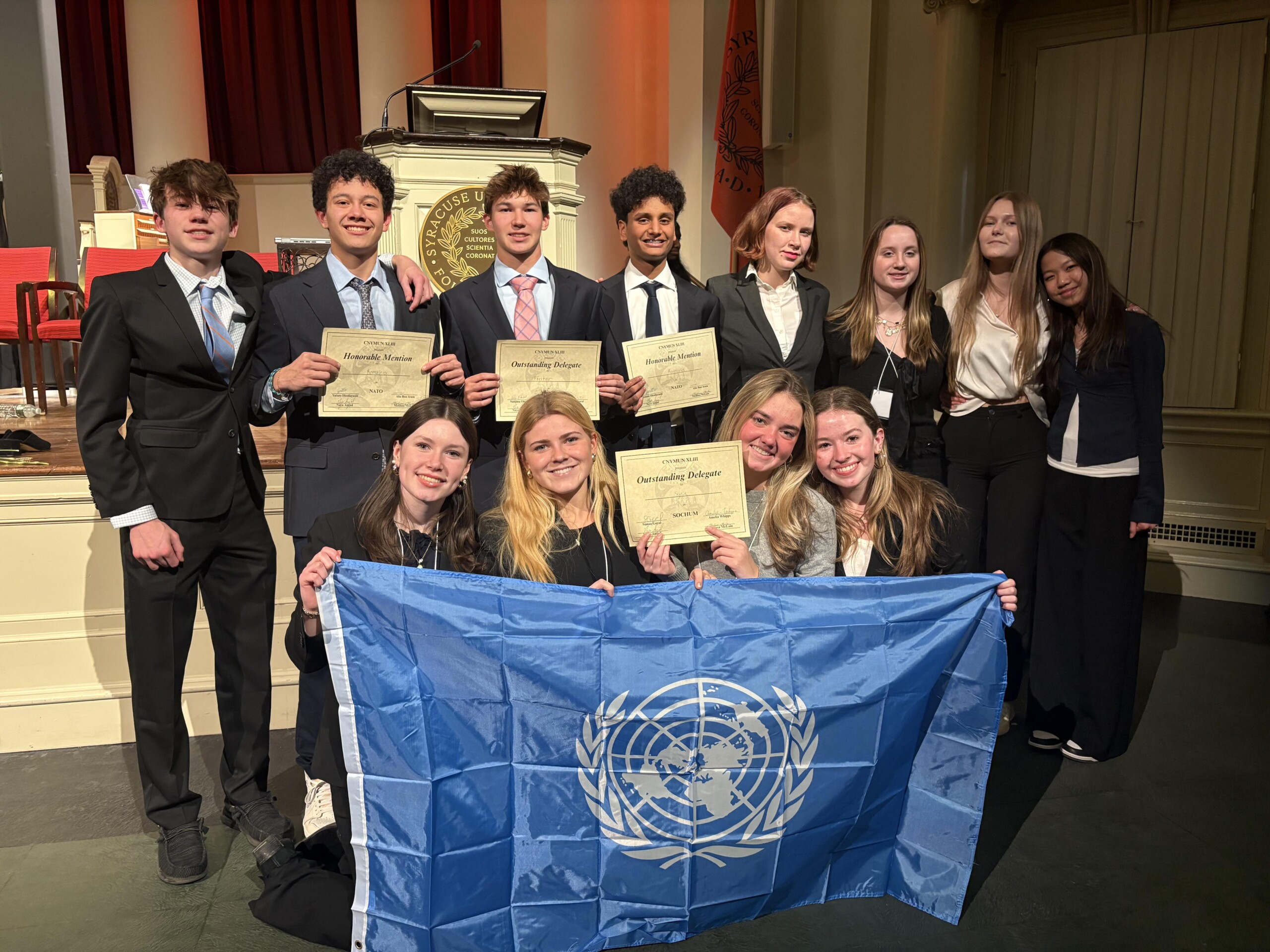 (PHOTO: Rye High School Model United Nations Club was named Best Small School Delegation at the 43rd Annual Central Model UN Conference in Syracuse on January 9-10, 2026. Back row: Owen Rothstein, Miles Silber, Dylan Smailes, Rajan Patel, Greta Murdoch, Lily Zaicek, Evelina Levickaja, Chloe Wang. Front Row: Fiona Green, Peyton Leahy, Caleigh Wardle, Ainsley Parks. Contributed.)