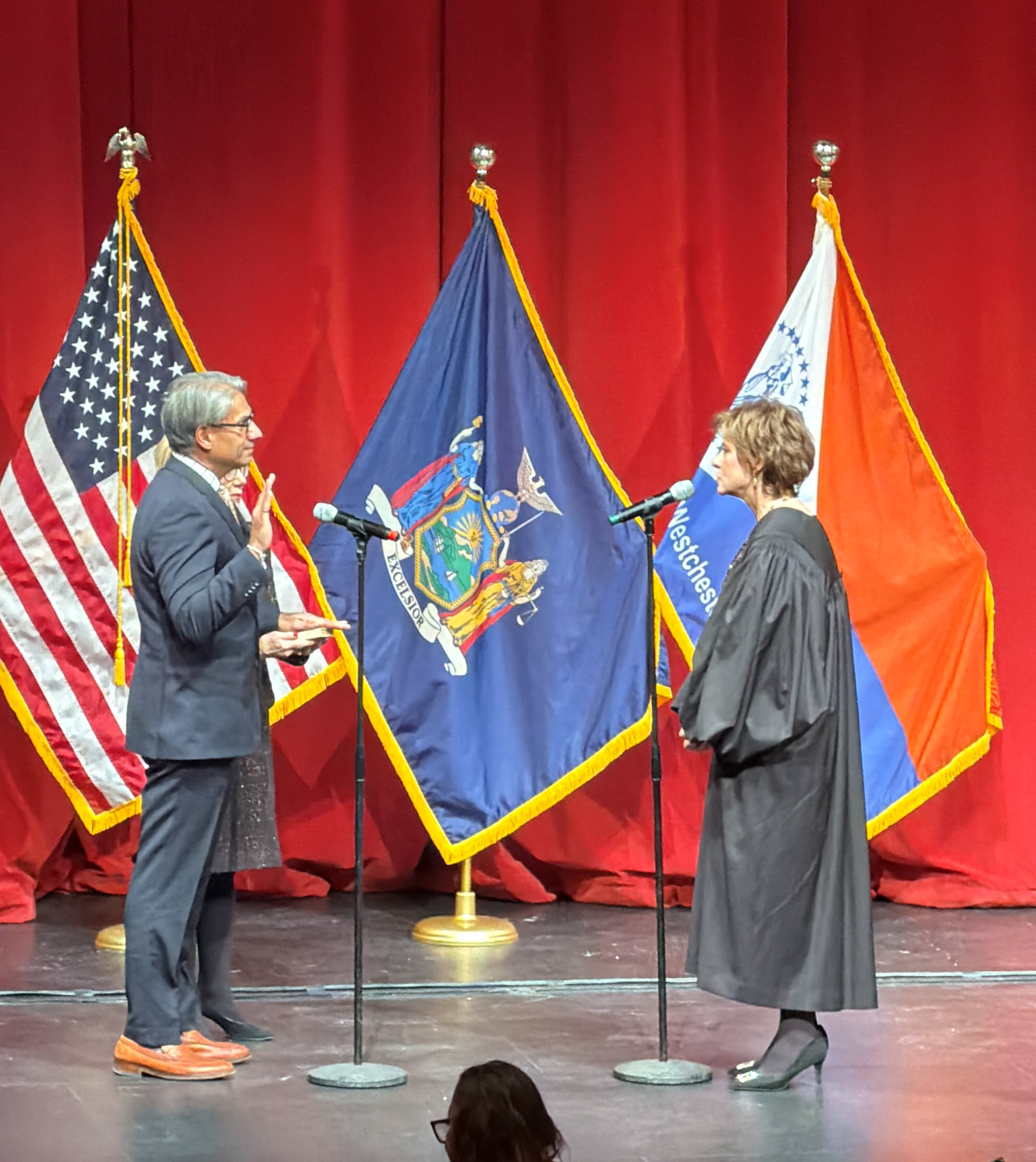 (PHOTO: Rye's new County Legislator Anant Nambiar (District 7) took the oath of office administered by the Honorable Anne E. Minihan on January 1, 2026 at the Performing Art Center at Purchase College.)