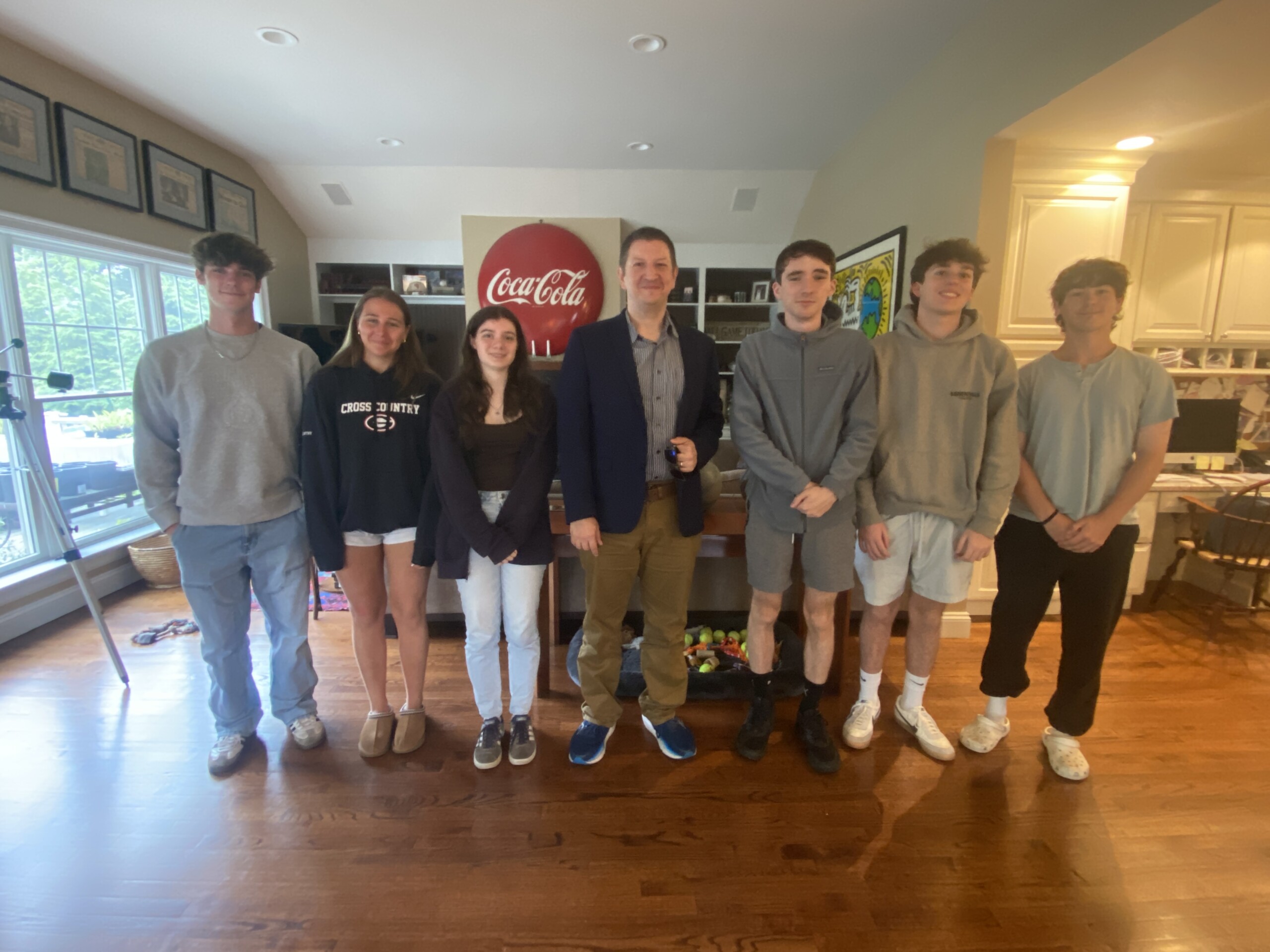 (PHOTO: MyRye.com intern Will Kressler (second from right) with other interns during a speaker session with New York Post editor Mark Lungariello, summer 2025.)