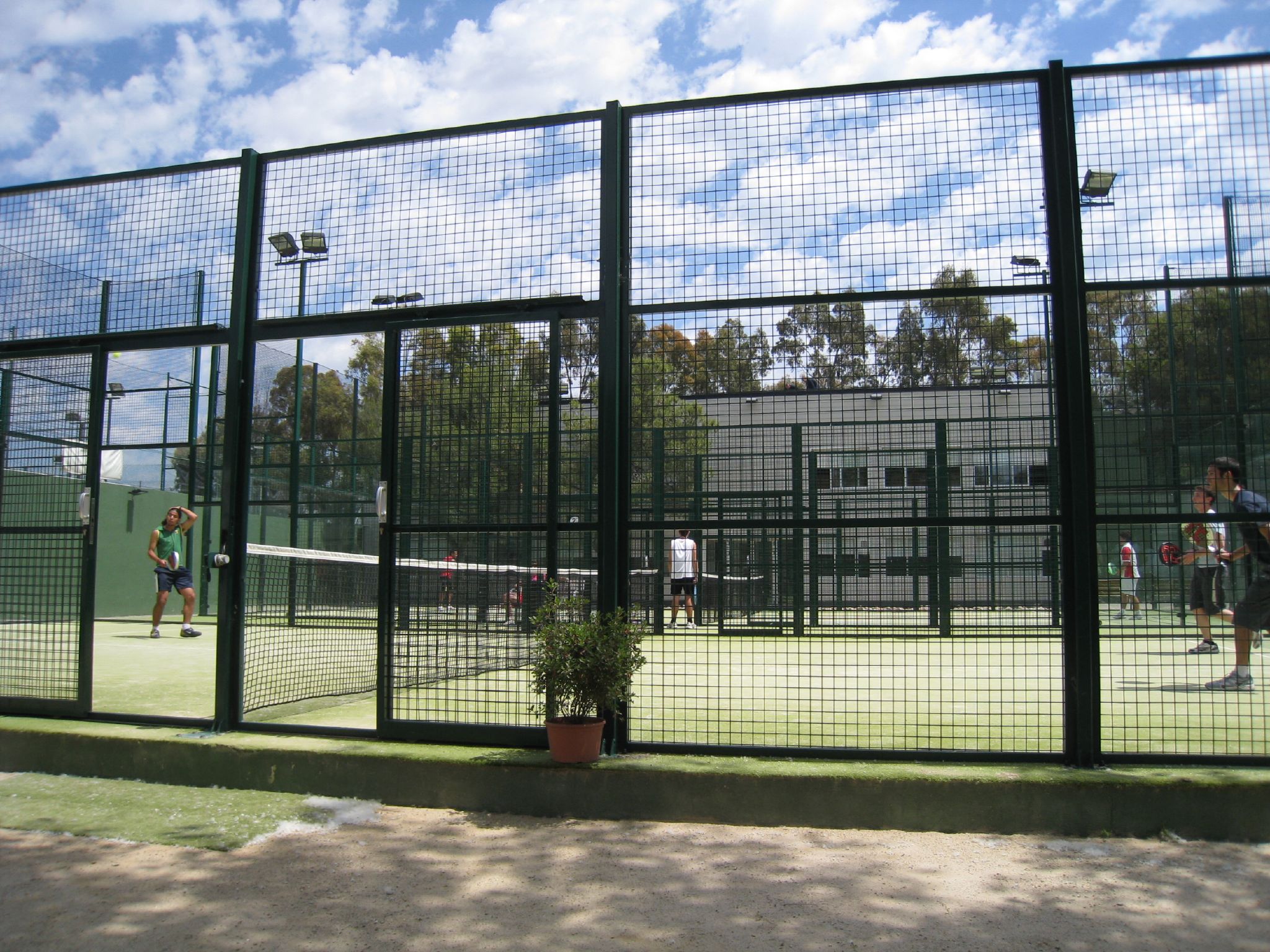 (PHOTO: Padel players on outdoor padel courts - Manursing Island Club is planning to install two padel courts. Padel is a racquet sport that combines elements of tennis and squash. Credit: Jacky Cheong under CC 2.0.)