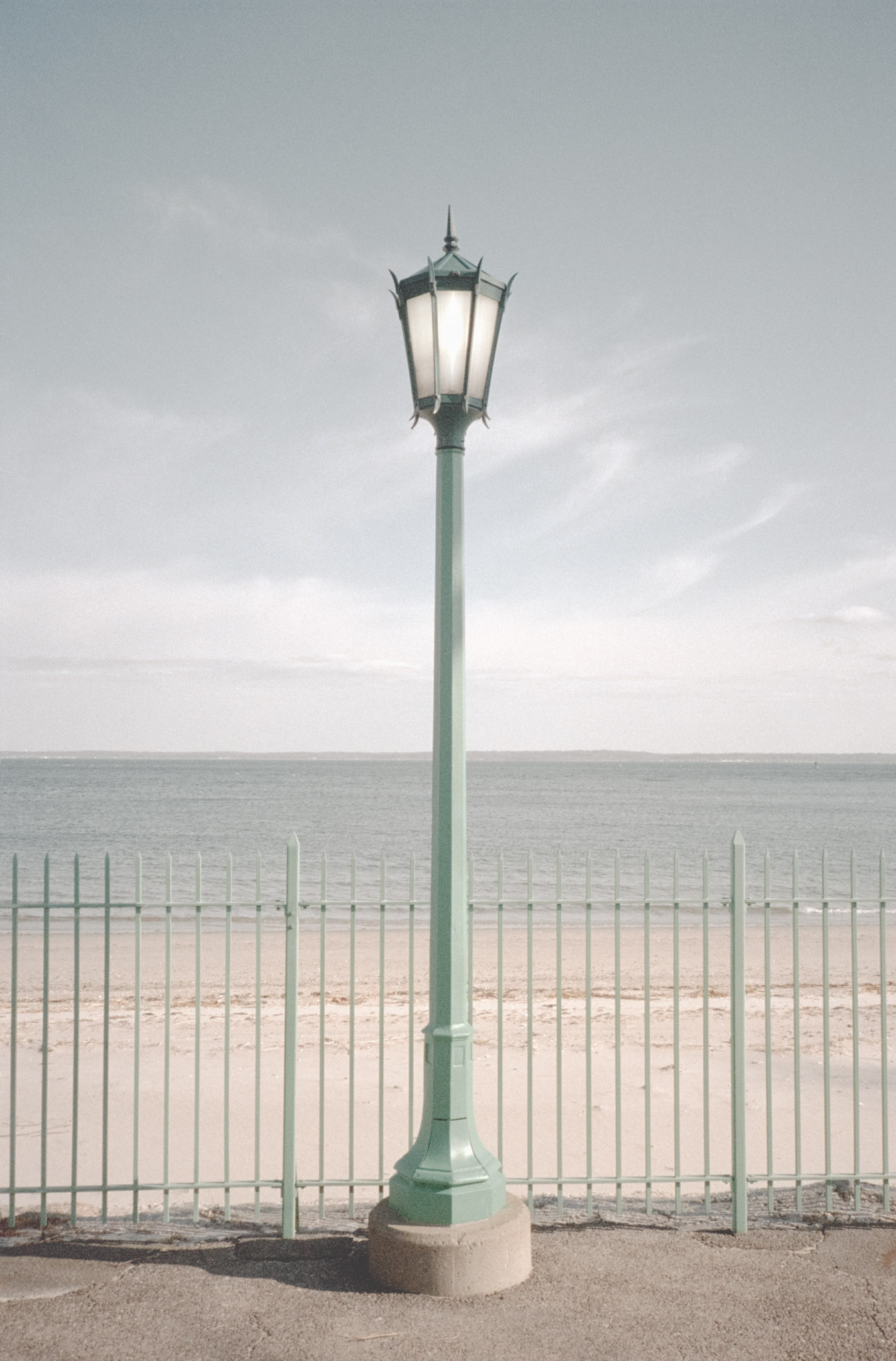 (PHOTO: Boardwalk Light. One of the iconic green lampposts that line the boardwalk at Playland in Rye, NY. By Markus Peters.)