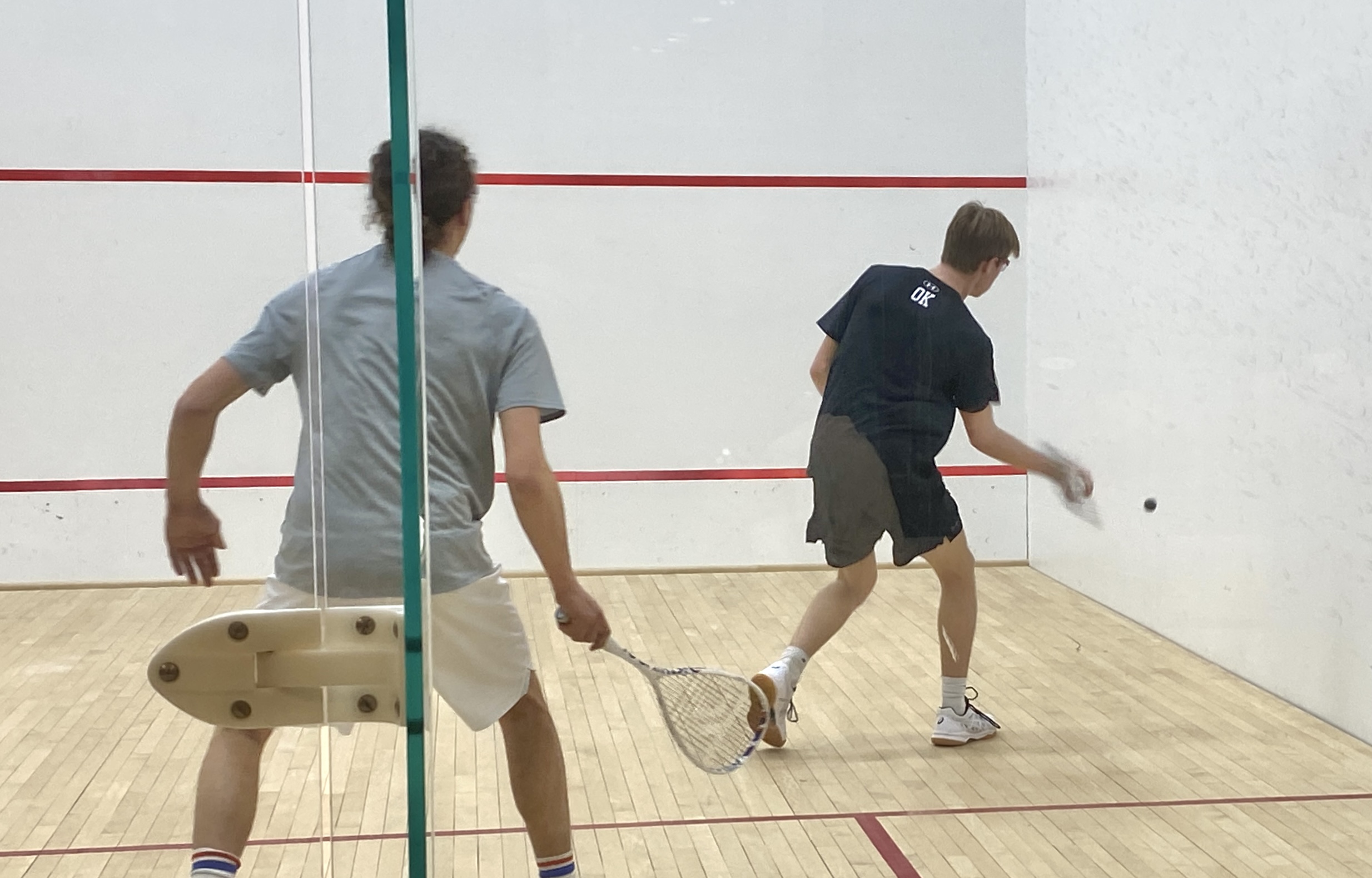 (PHOTO: Rye Boys Squash's Owen Karl (right) from a match vs Masters on February 12, 2026. Contributed.)