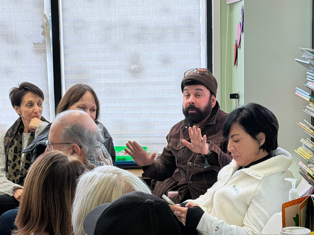 (PHOTO: Bobby Bianca, who runs the Bring Back the Airplane Coaster! Facebook group, speaking at the inaugural meeting of new Friends of Rye Playland group on Saturday, February 7, 2026.)