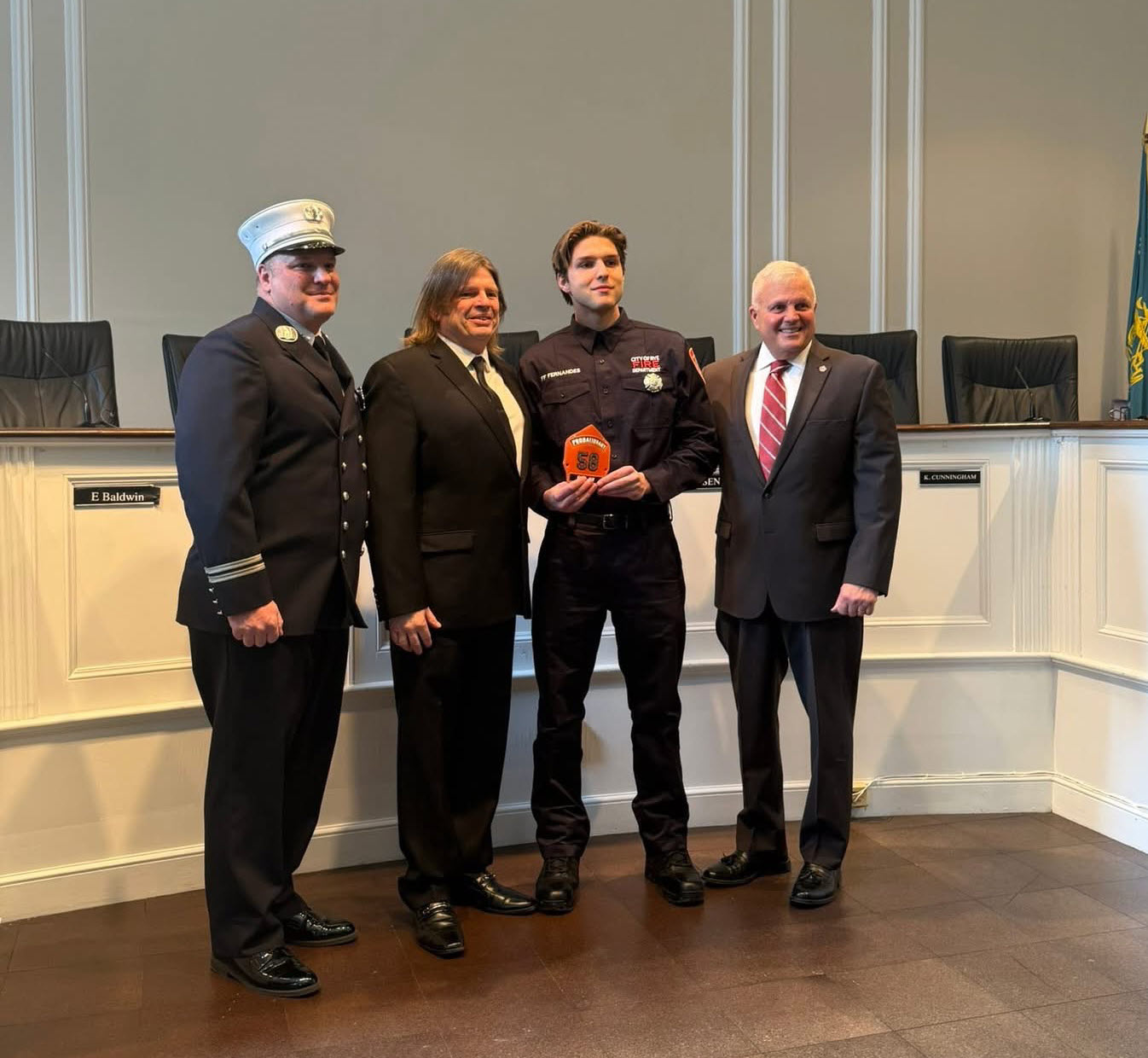 (PHOTO: At Rye City Hall on Tuesday, February 17, 2026 for the swearing in: Captain Clyde Pitts, former Rye firefighter Jeffrey Fernandes (senior), probationary firefighter Jeffrey Fernandes and Rye Public Safety Commissioner Mike Kopy. Contributed.)