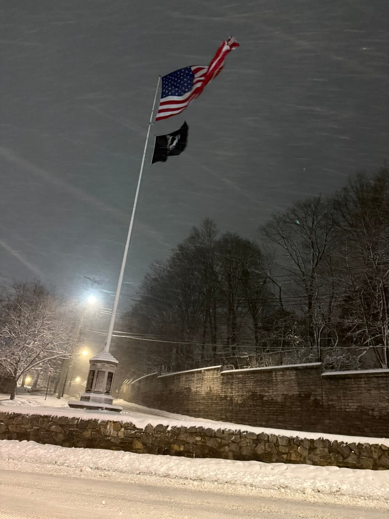 (PHOTO: The blizzard and bomb cyclone hit Rye, NY overnight into Monday, February 23, 2026. Viewable is the flagpole at the intersection of Boston Post Road and Purchase Street in Rye. Source: Rye PD.)