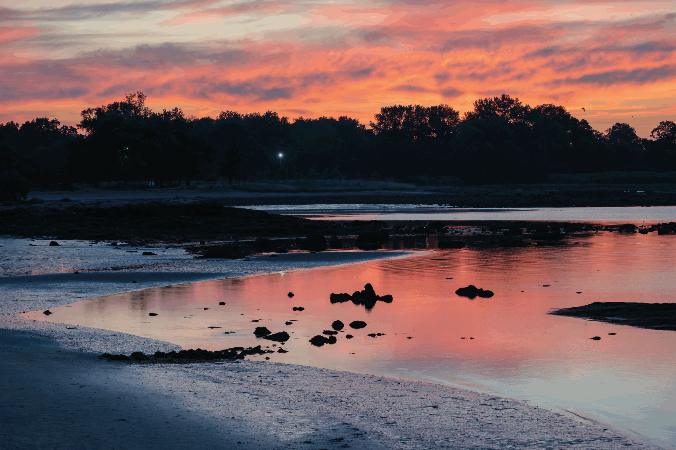 (PHOTO: Mesmerizing Skies. Red skies reflecting in the water turning the whole world red. By Stacey Massey, author of First Light, Rye.)